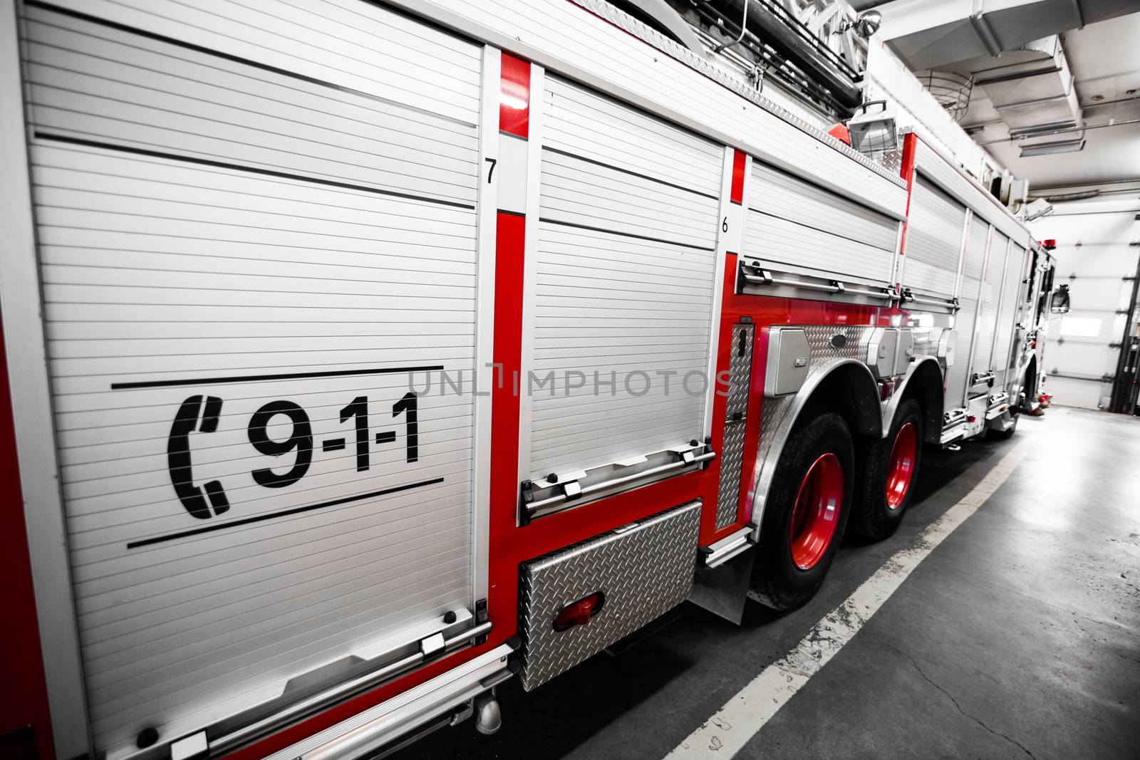 Red Firetruck Details of the Side and of the 911 telephone Sign