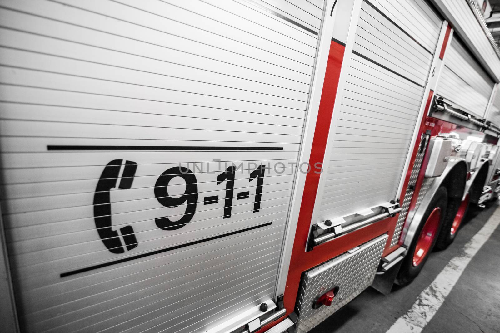 Red Firetruck Details of the Side and of the 911 telephone Sign