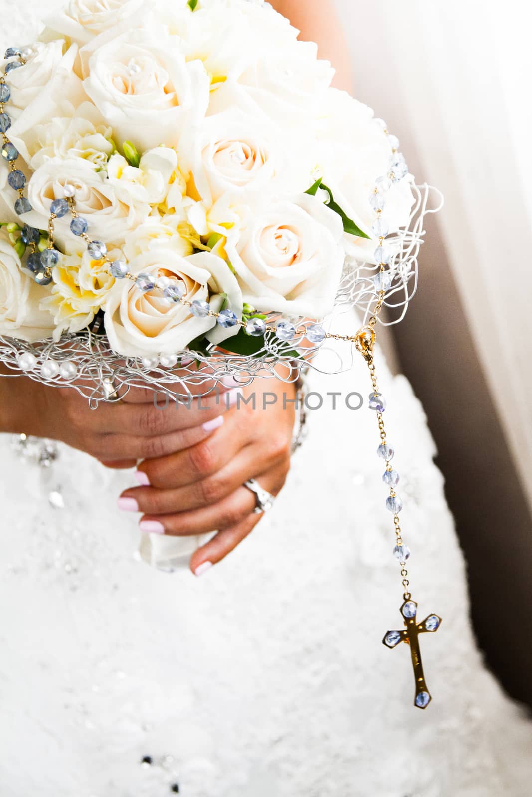 Bride Holding her Roses Bouquet and Rosary Close-up