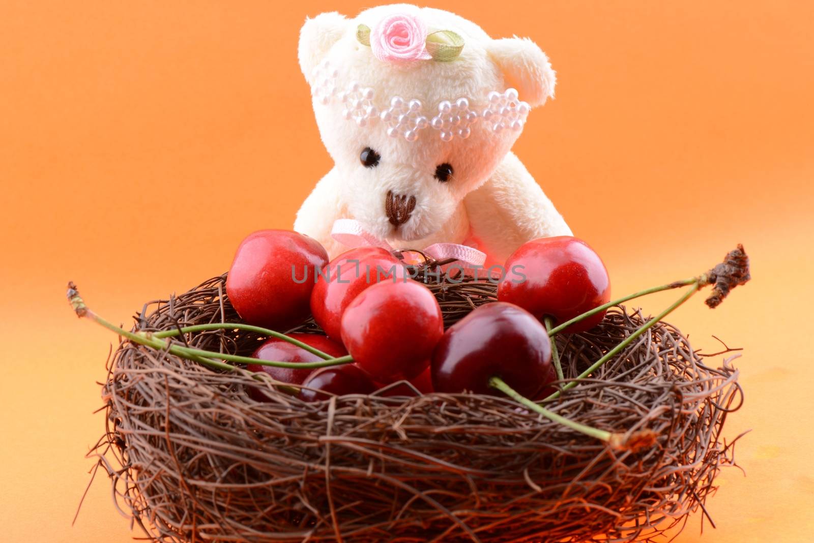 Toy teddy bear collecting Sweet cherries by bbbar