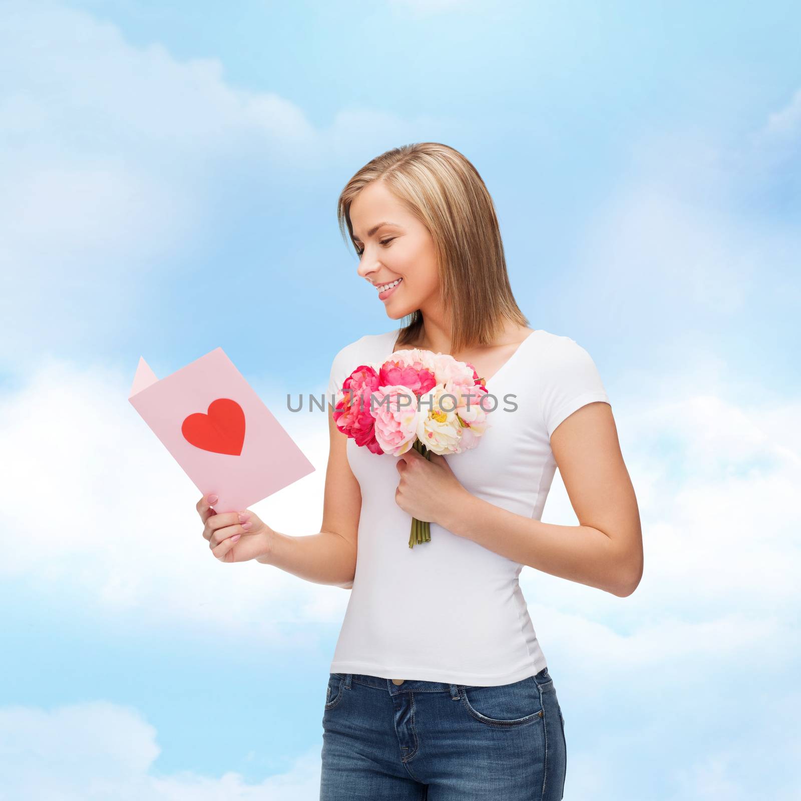 love, holidays and happiness concept - smiling girl with postcard and bouquet of lowers