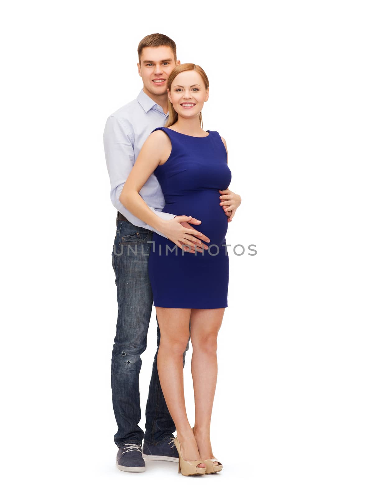 pregnancy, parenthood and happiness concept - happy young family expecting child