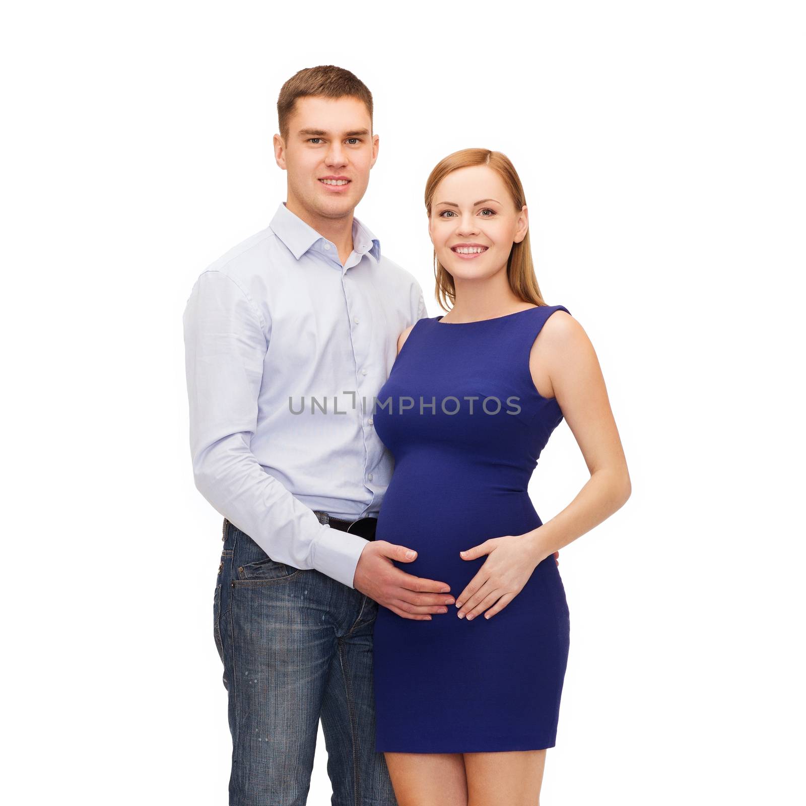 happy young family expecting child by dolgachov