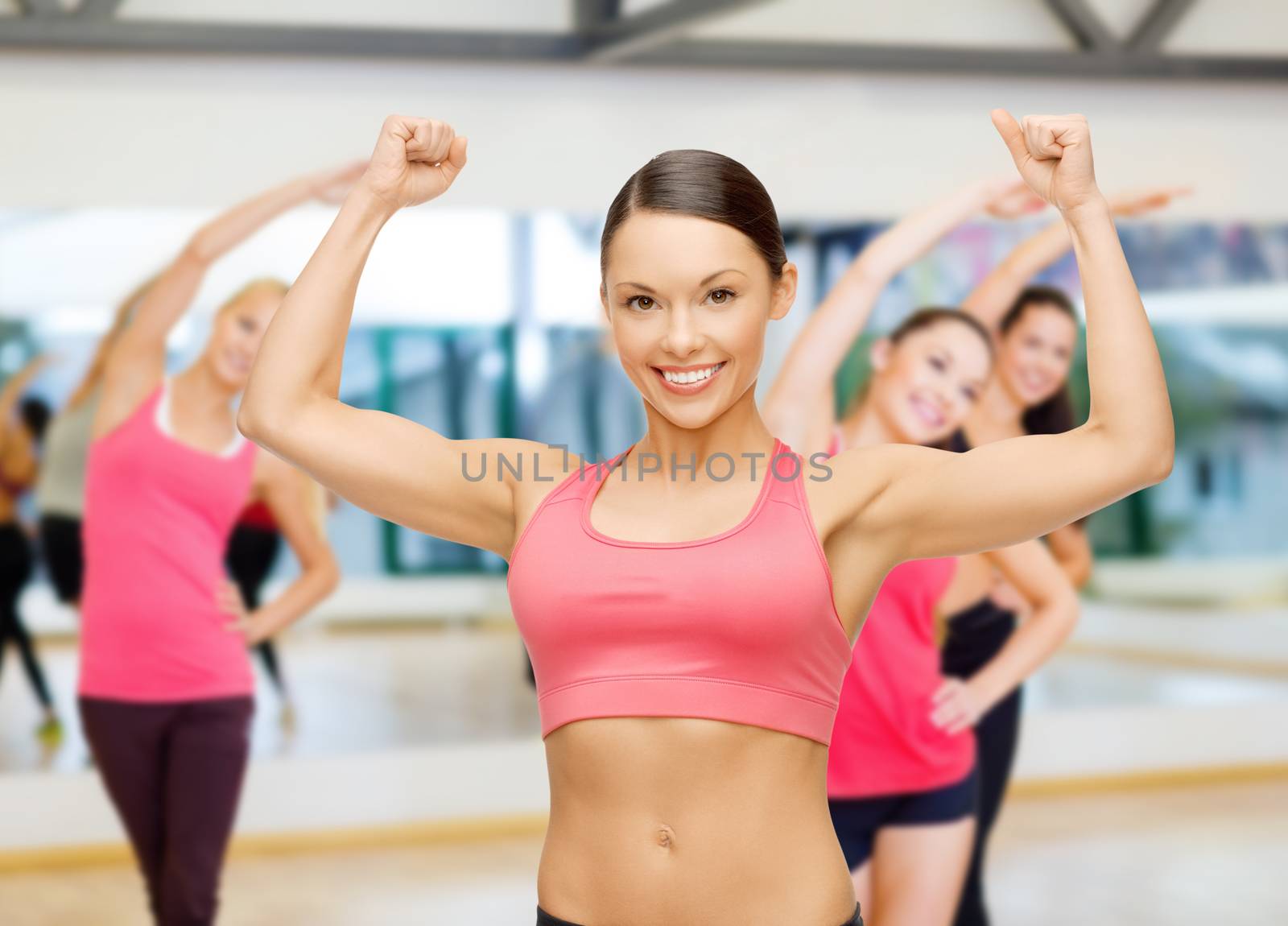 fitness, sport, training and lifestyle concept - personal trainer with group of smiling people in gym