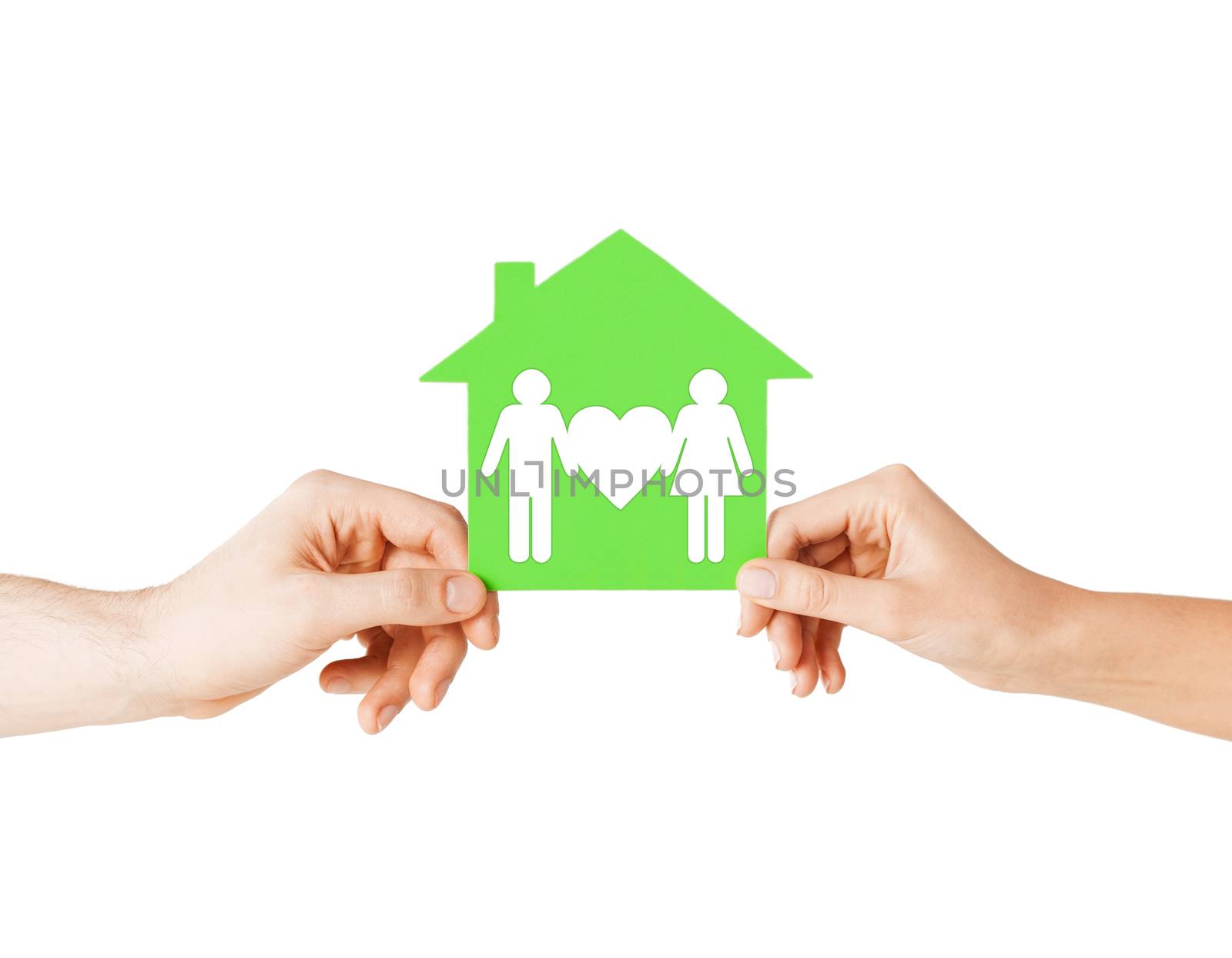 real estate and family home concept - isolated picture of male and female hands holding green paper house with family