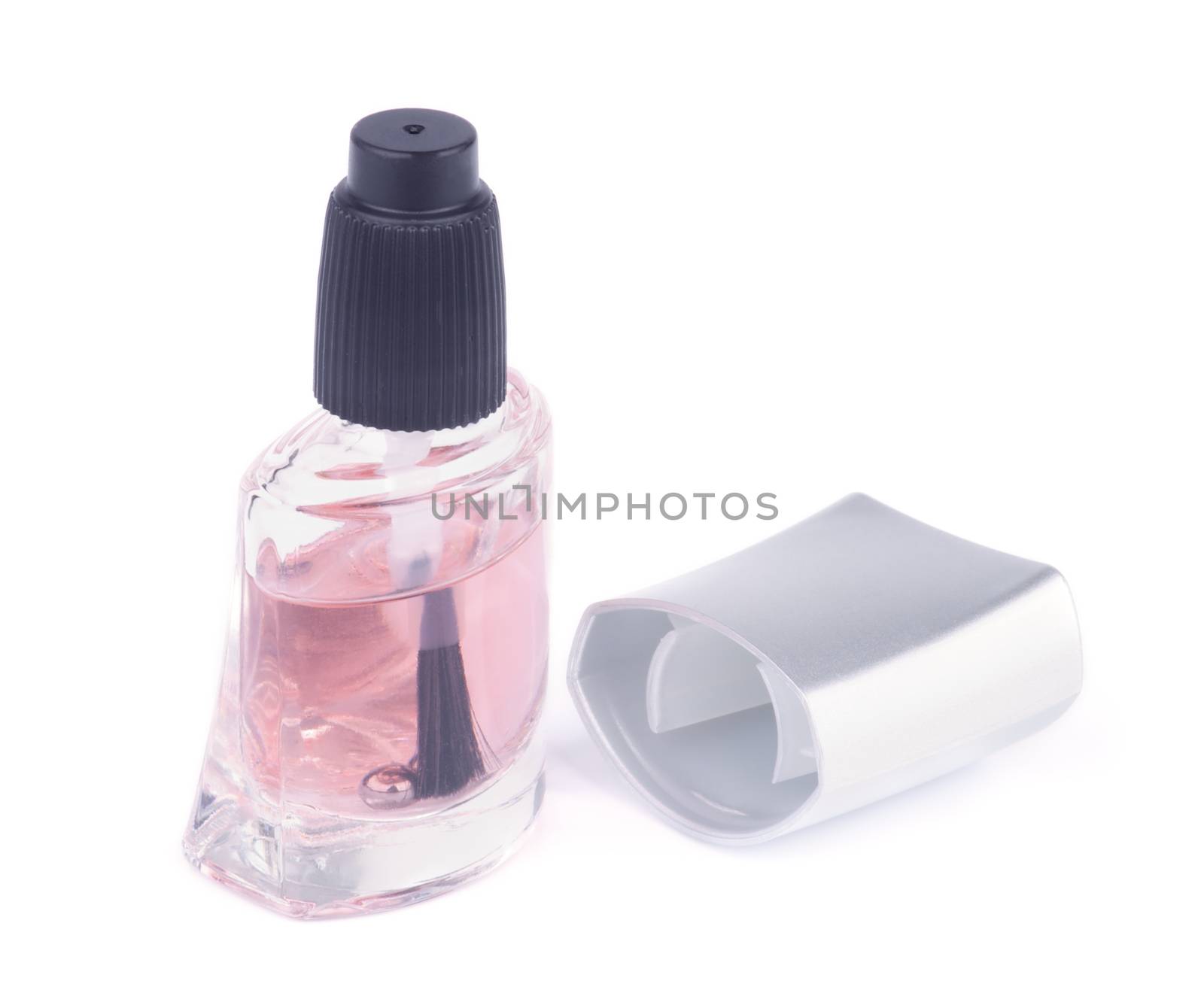 Transparent Care Pink Nail Polish and Bottle Cap isolated on white background