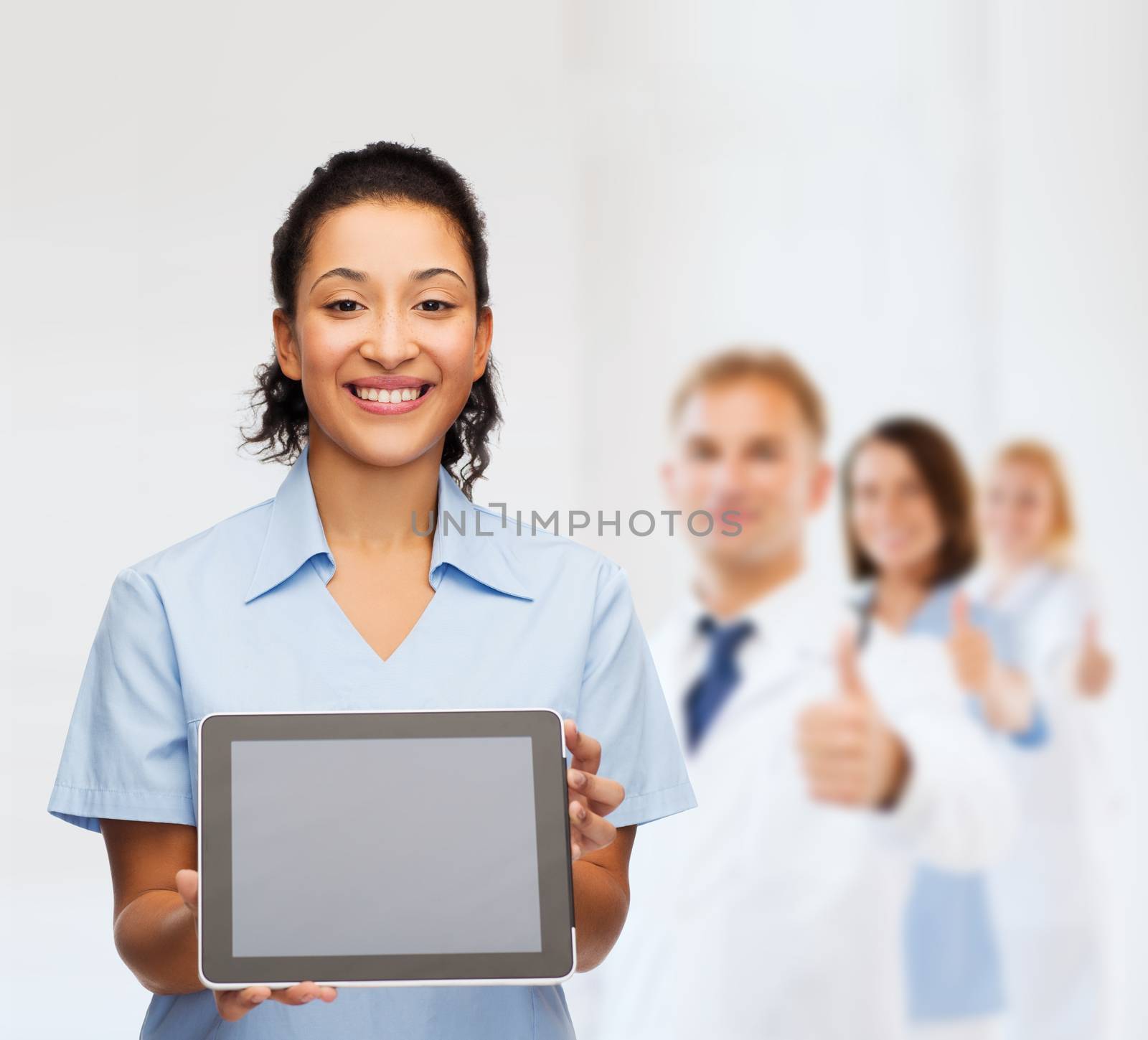 healthcare, medicine and technology concept - smiling african american female doctor or nurse with tablet pc computer
