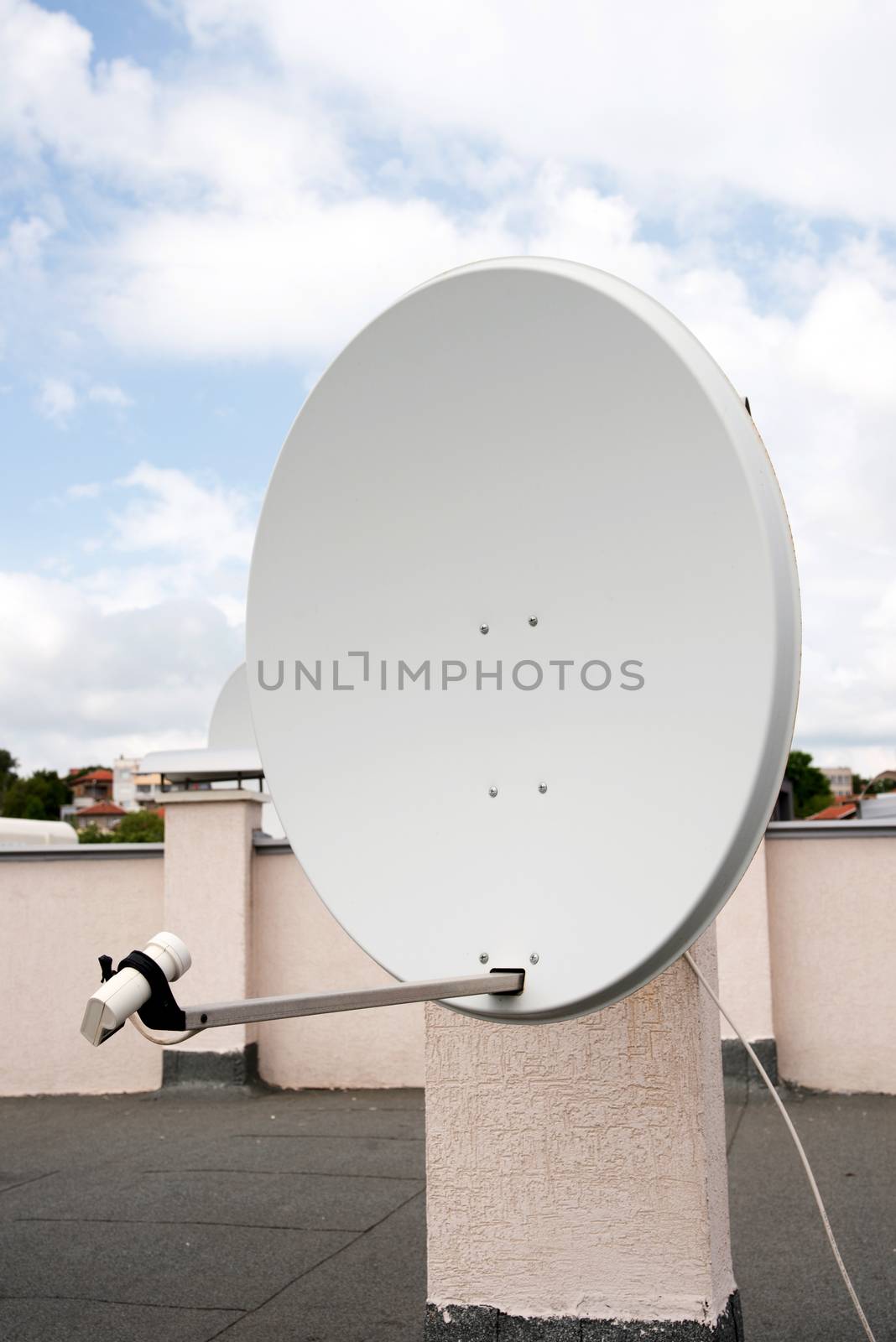 television antenna mounted on roof of the high-rise building