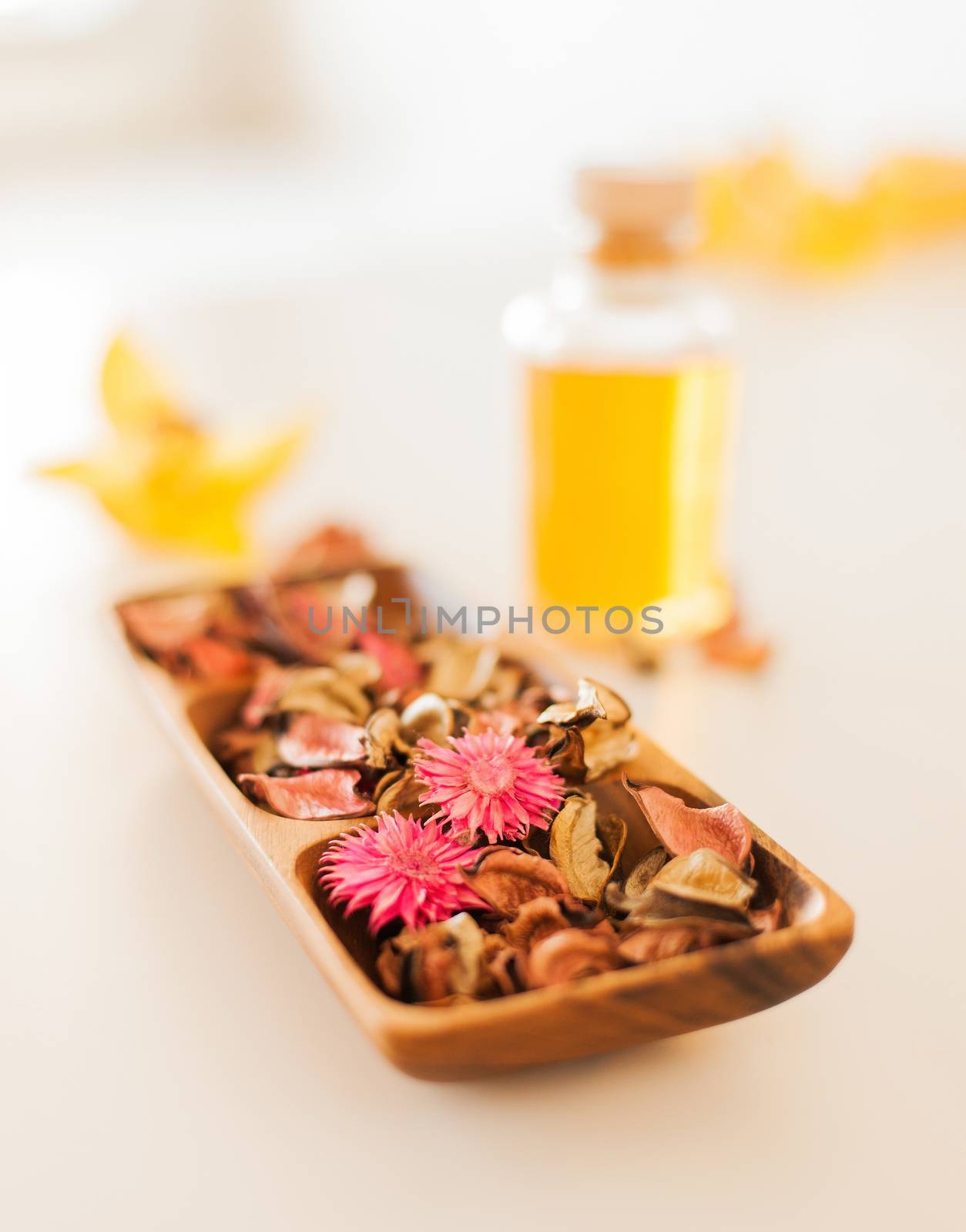 spa, health and beauty concept - closeup of essential oil, flowers and pot-pourri