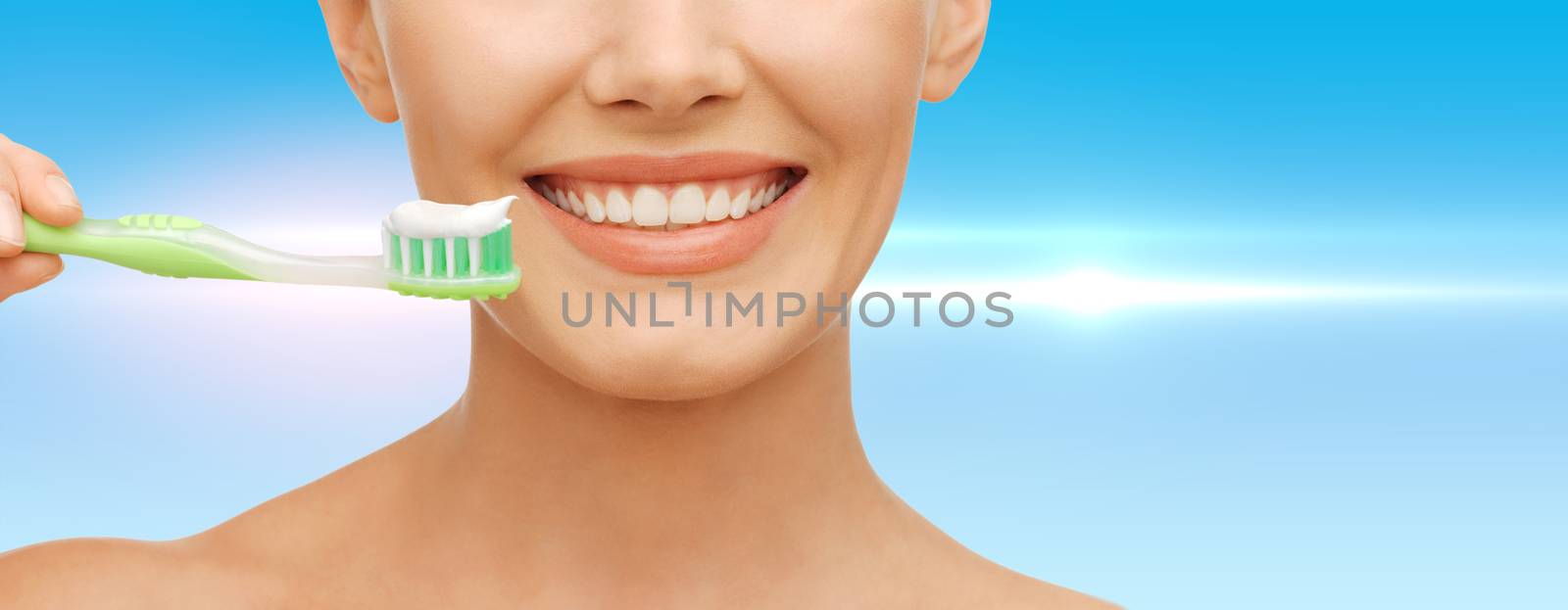 beauty and dental health concept - beautiful woman with green toothbrush