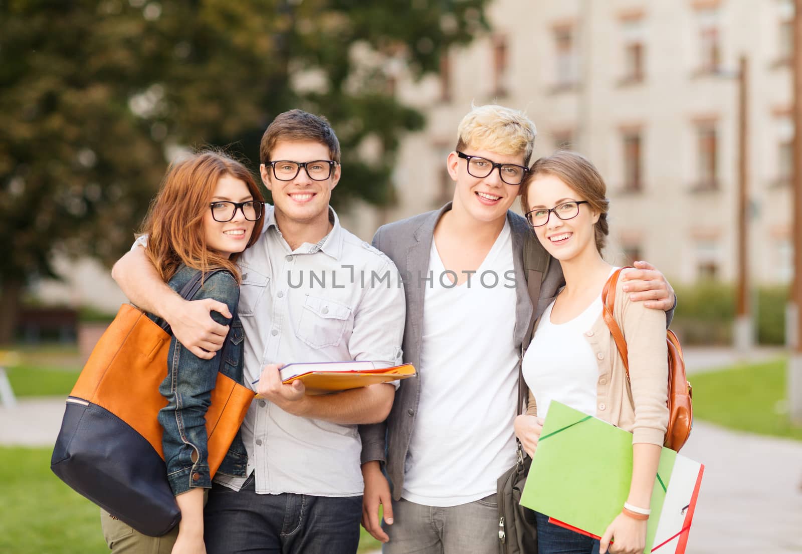 summer holidays, education, campus and teenage concept - group of students or teenagers with files, folders and eyeglasses hanging out