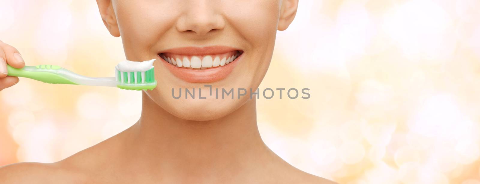 beautiful woman with toothbrush by dolgachov