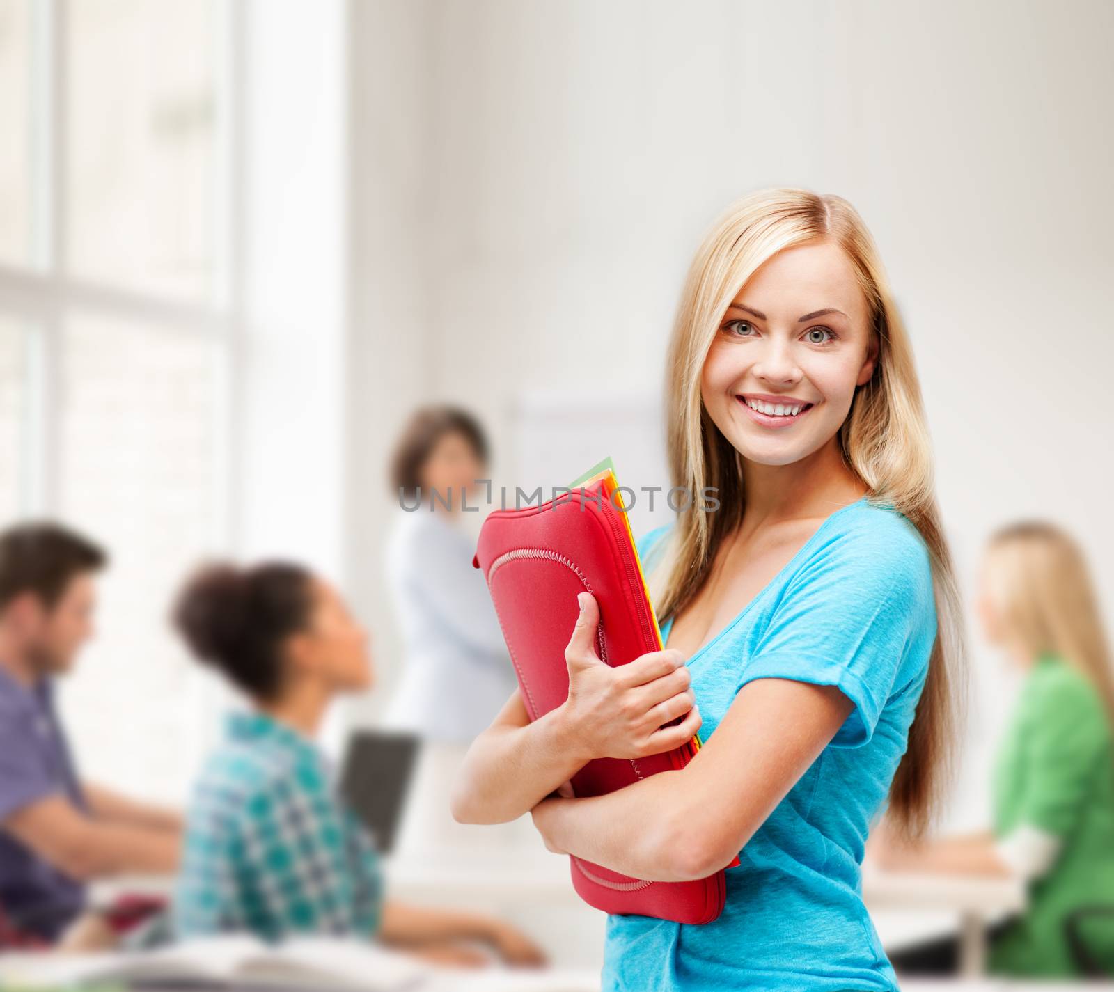 school and education concept - smiling student with folders