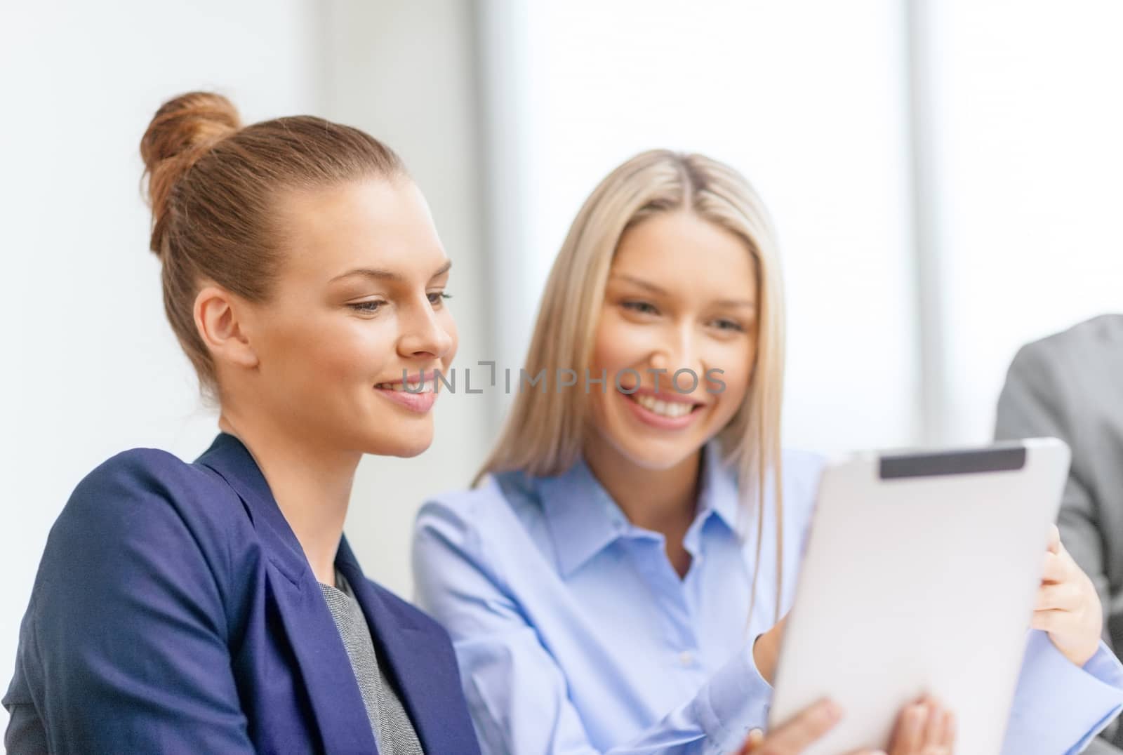 business team with tablet pc having discussion by dolgachov