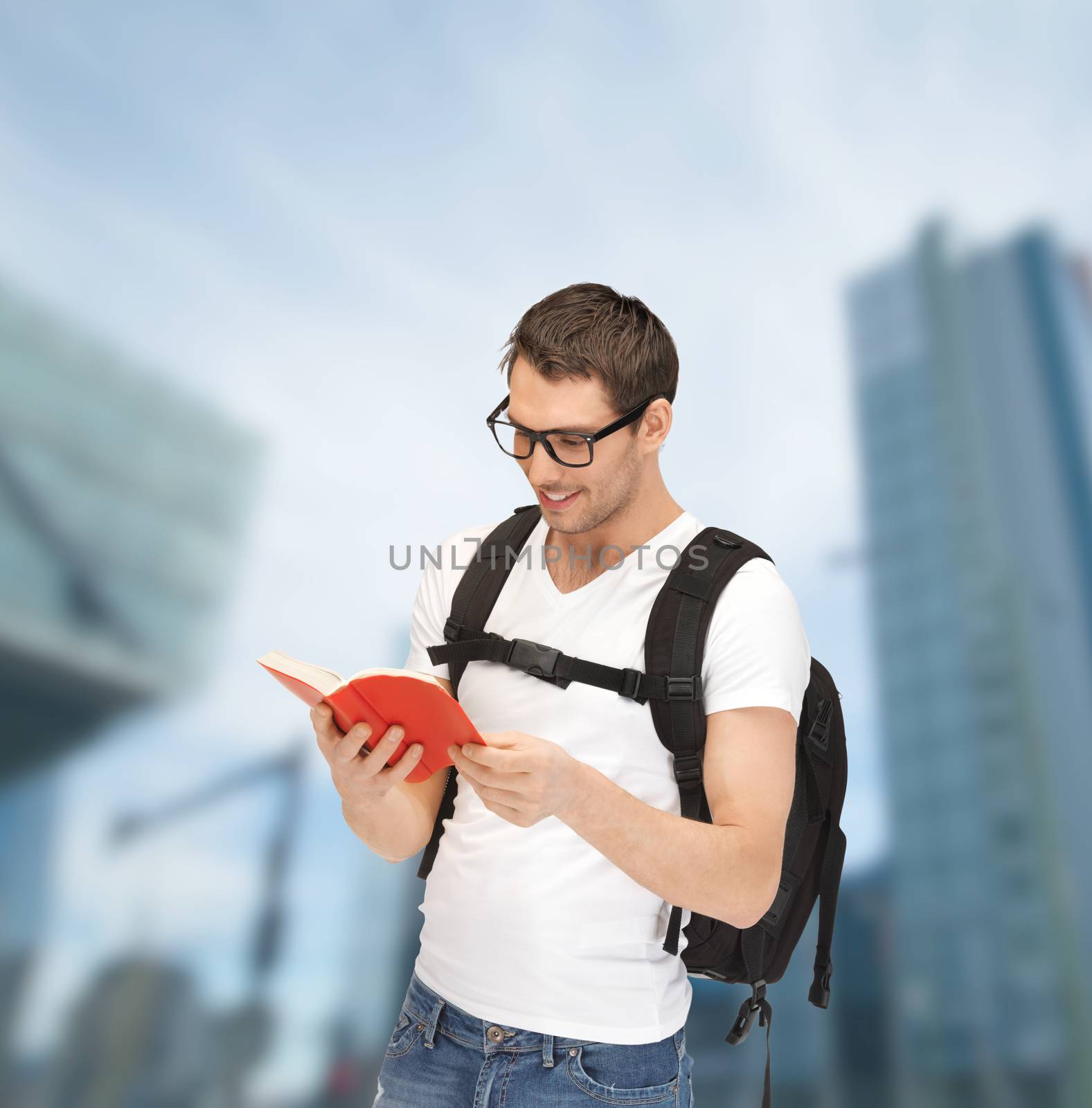 student in eyeglasses with backpack and book by dolgachov