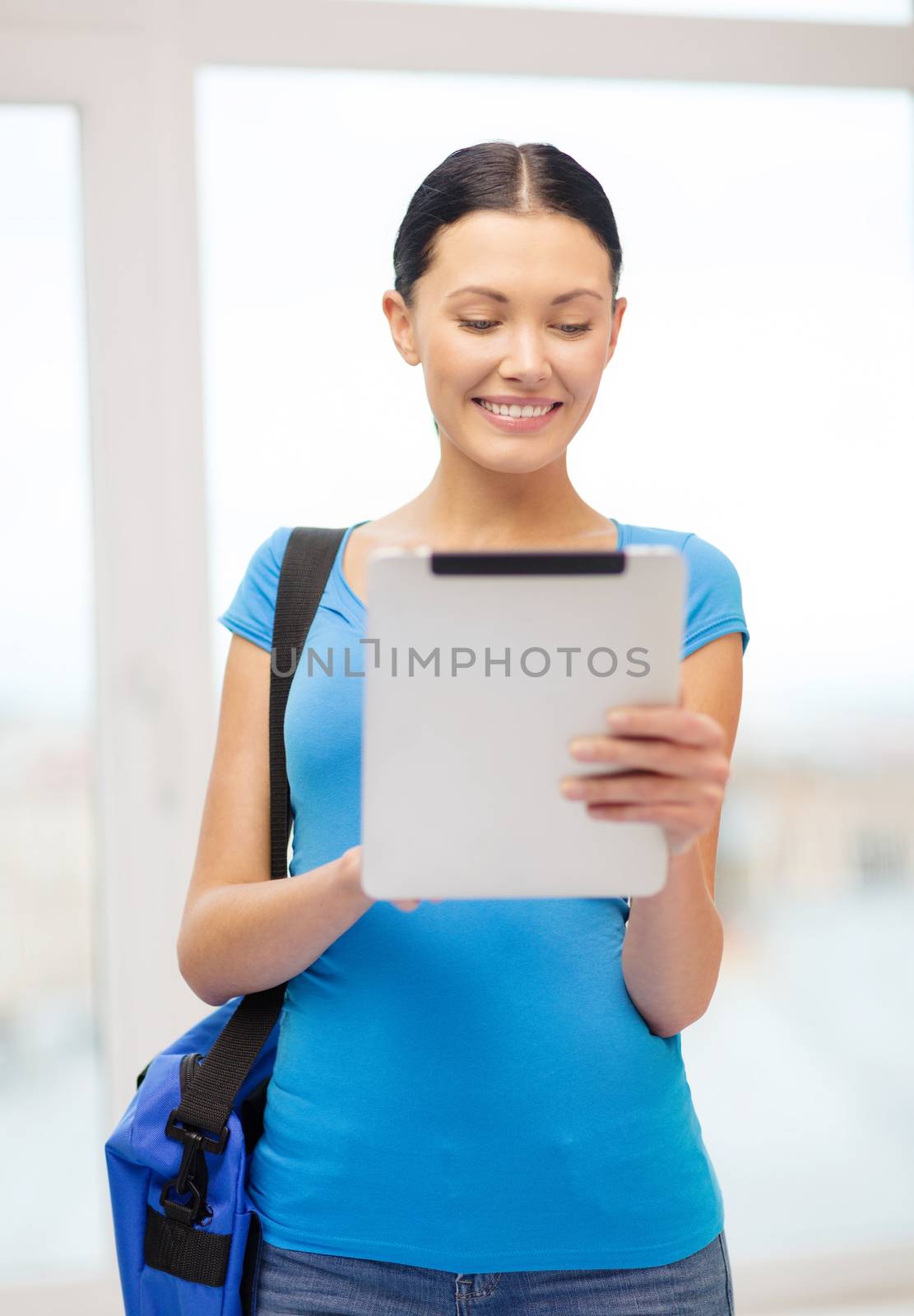 education, technology, communication and school concept - smiling female student with tablet pc and bag at school