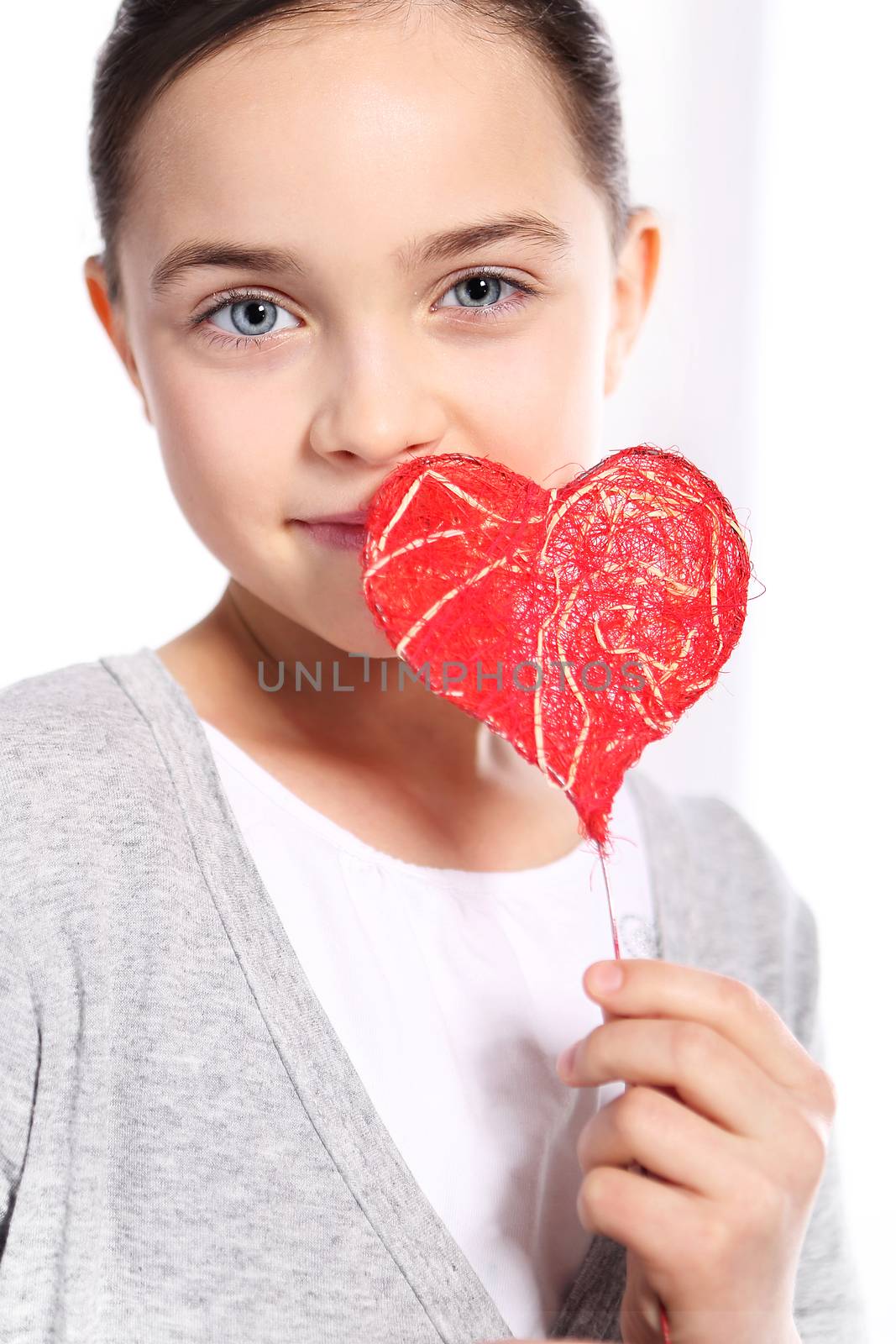 Portrait of a girl with red heart symbol