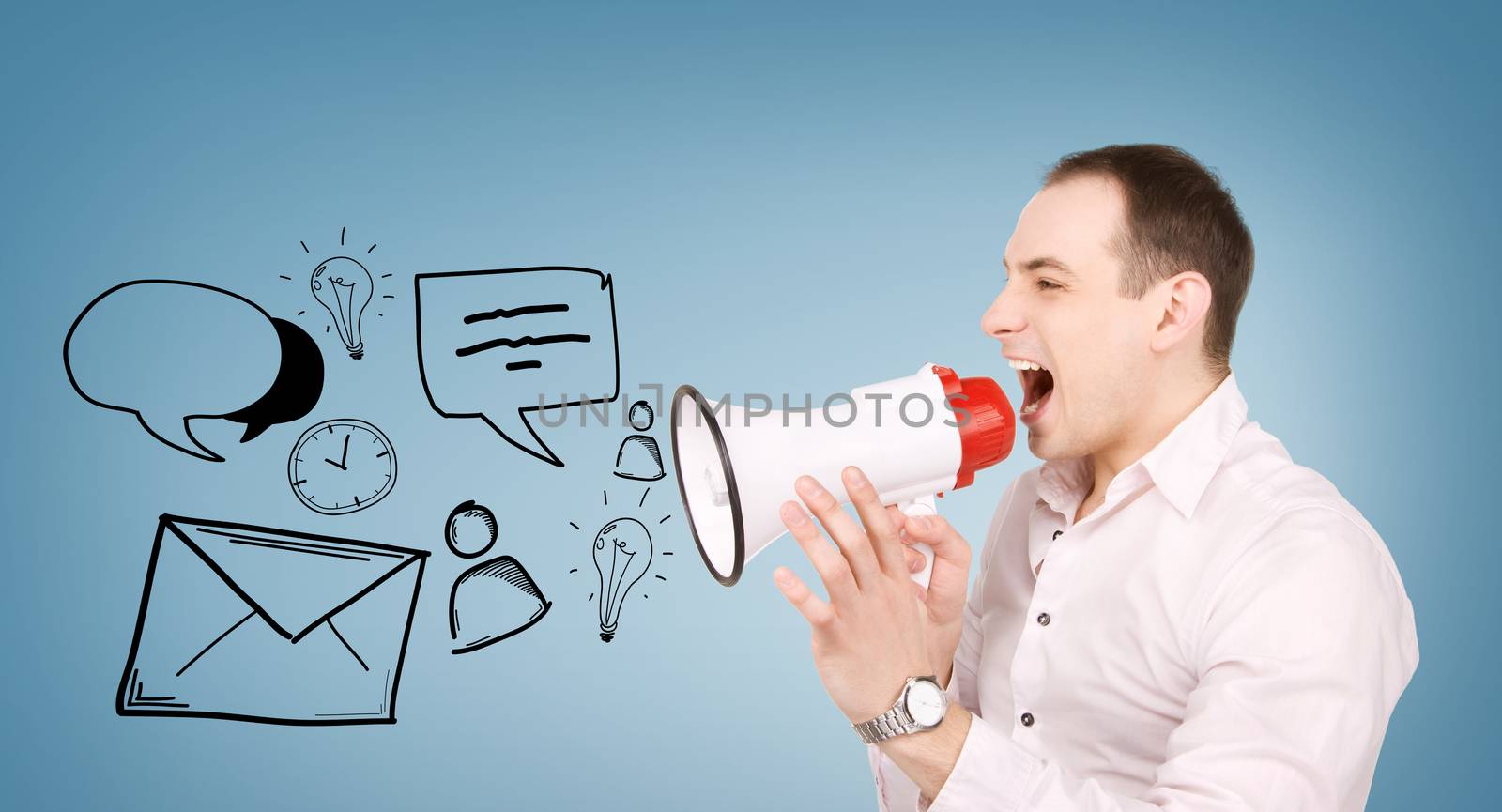 communication concept - businessman with megaphone over blue background