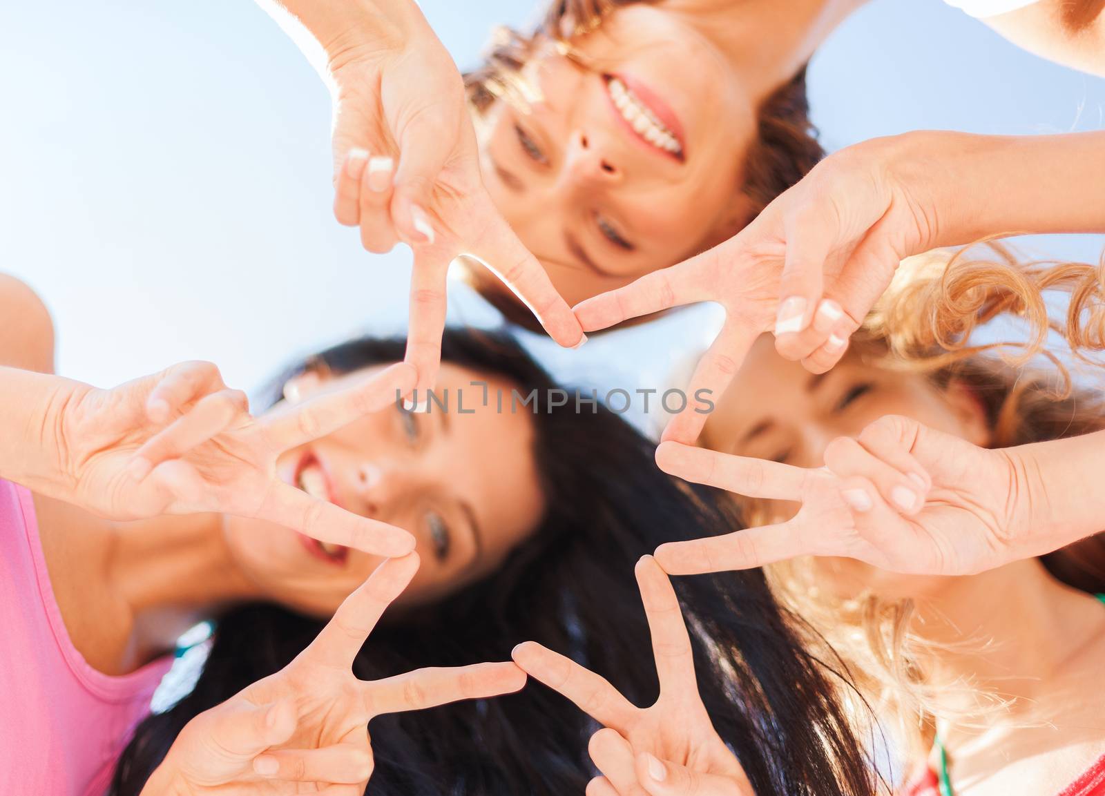 girls looking down and showing finger five gesture by dolgachov