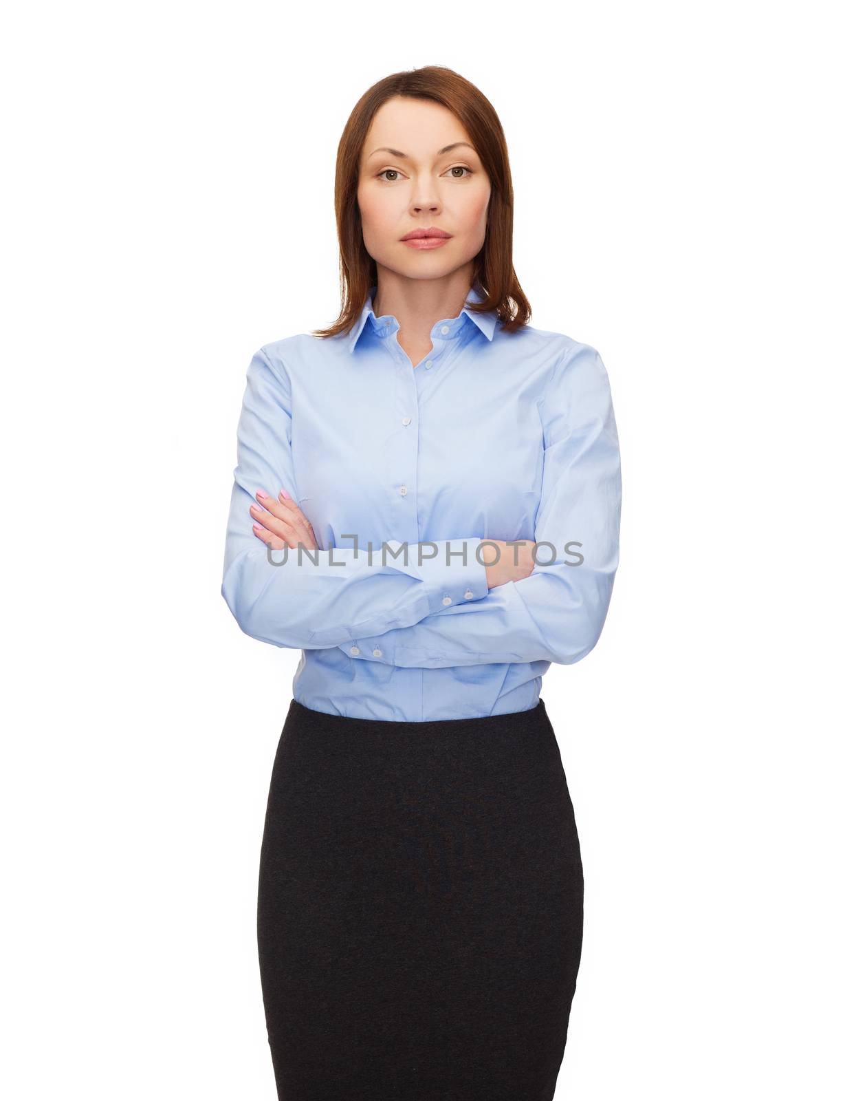 smiling businesswoman with crossed arms by dolgachov