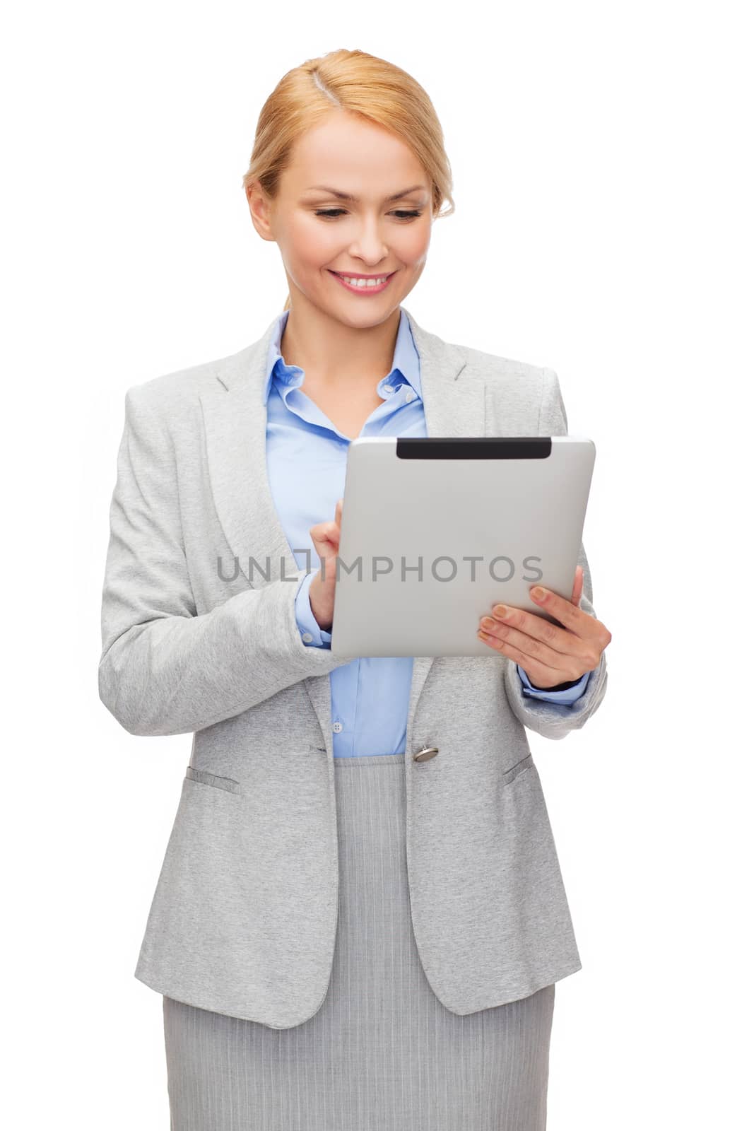 smiling woman looking at tablet pc by dolgachov