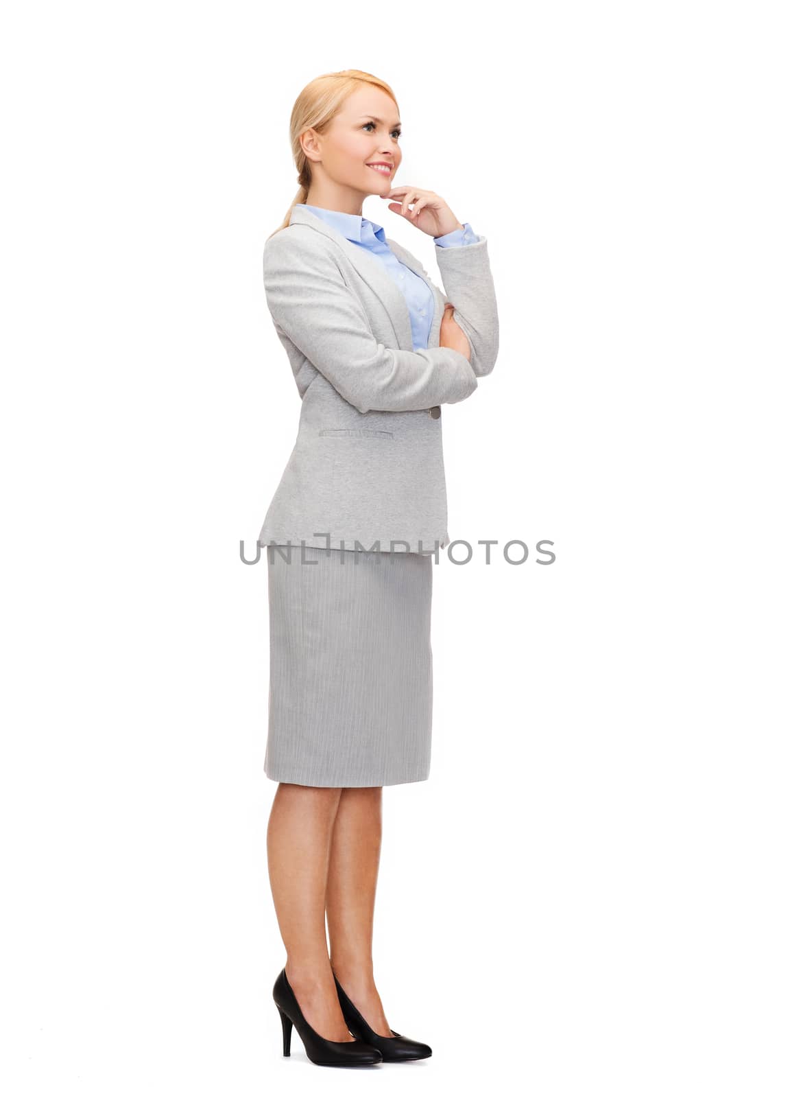 smiling businesswoman with crossed arms by dolgachov