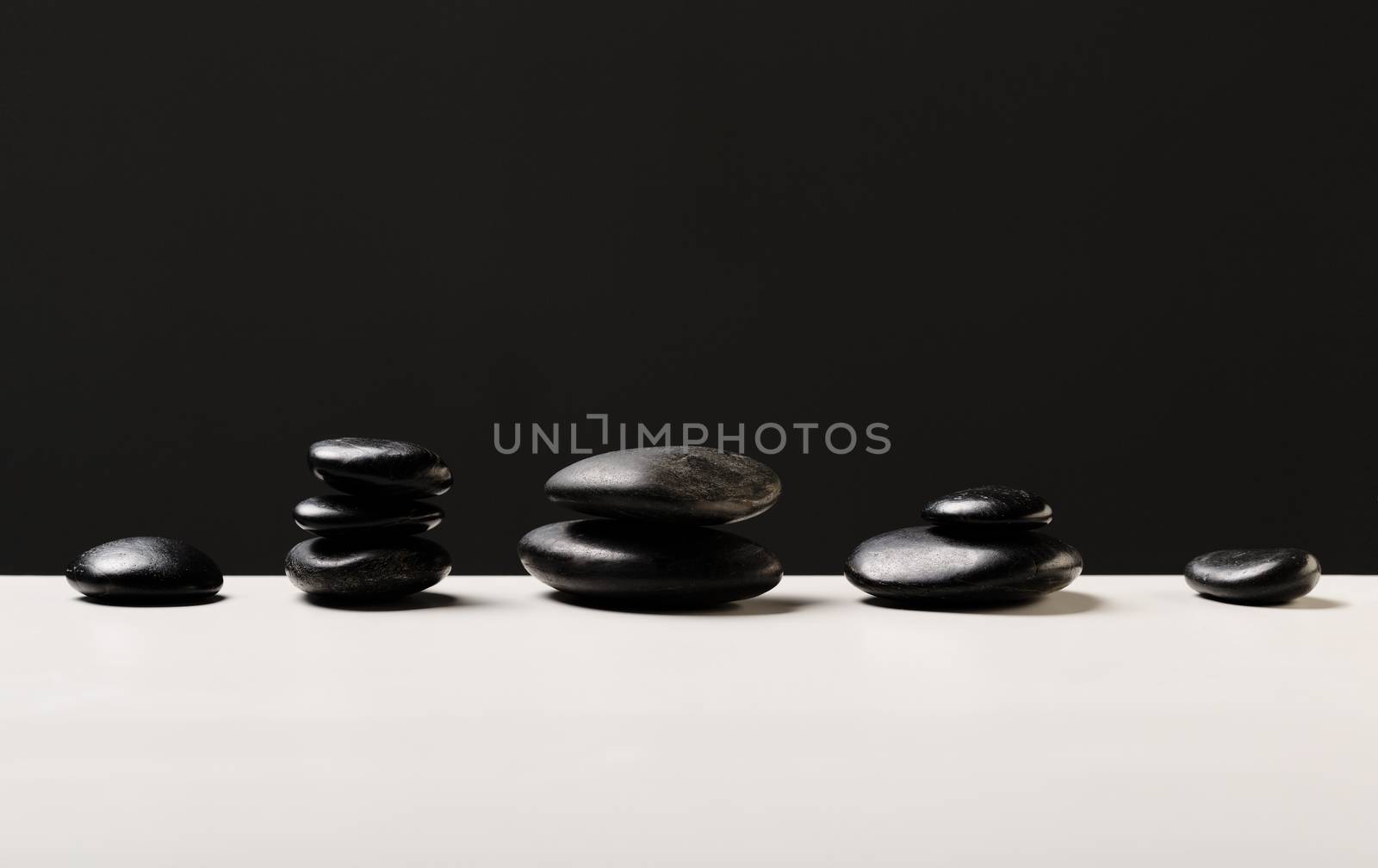 closeup of hot massage stones by dolgachov