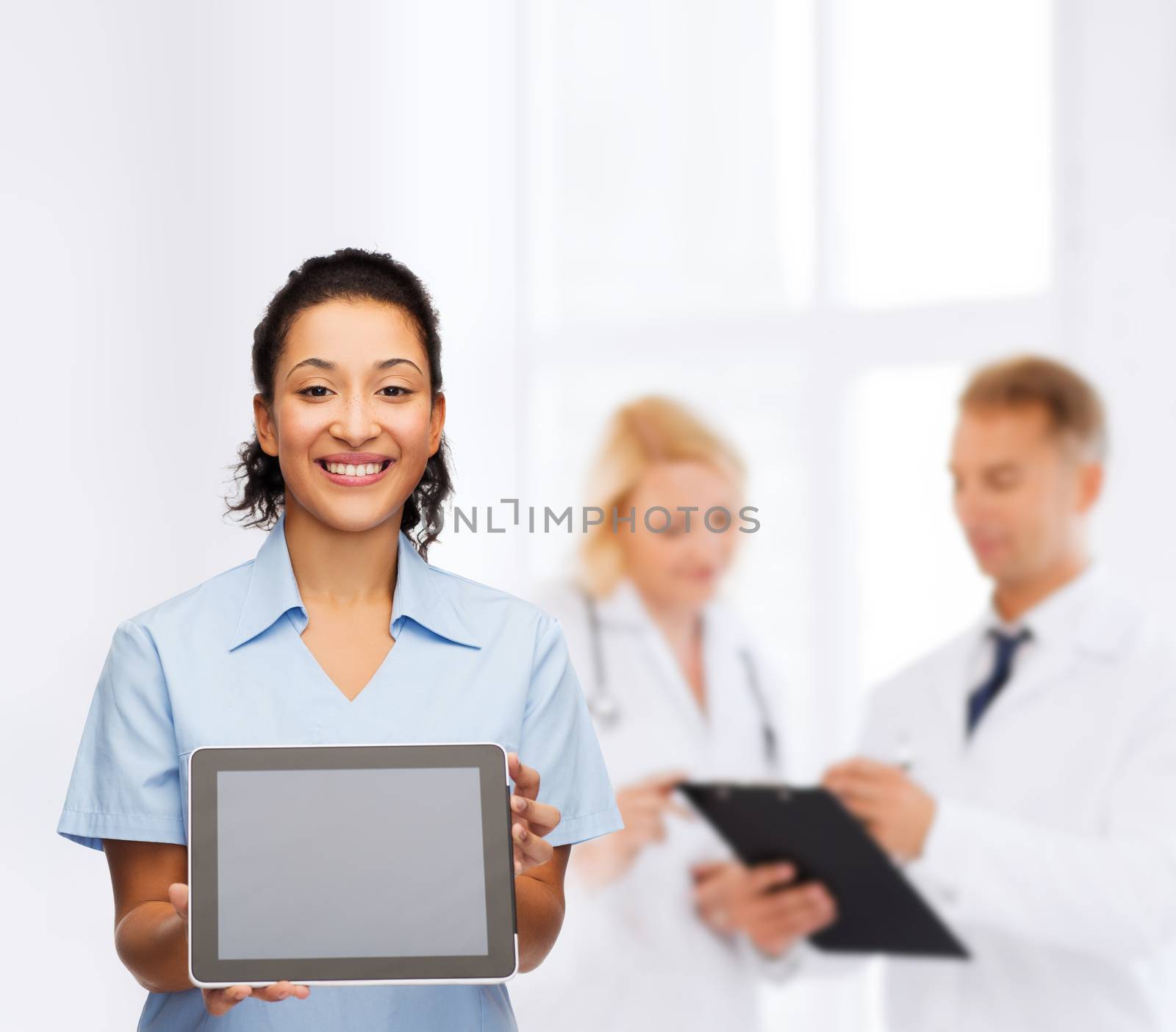 healthcare, medicine and technology concept - smiling african american female doctor or nurse with tablet pc computer