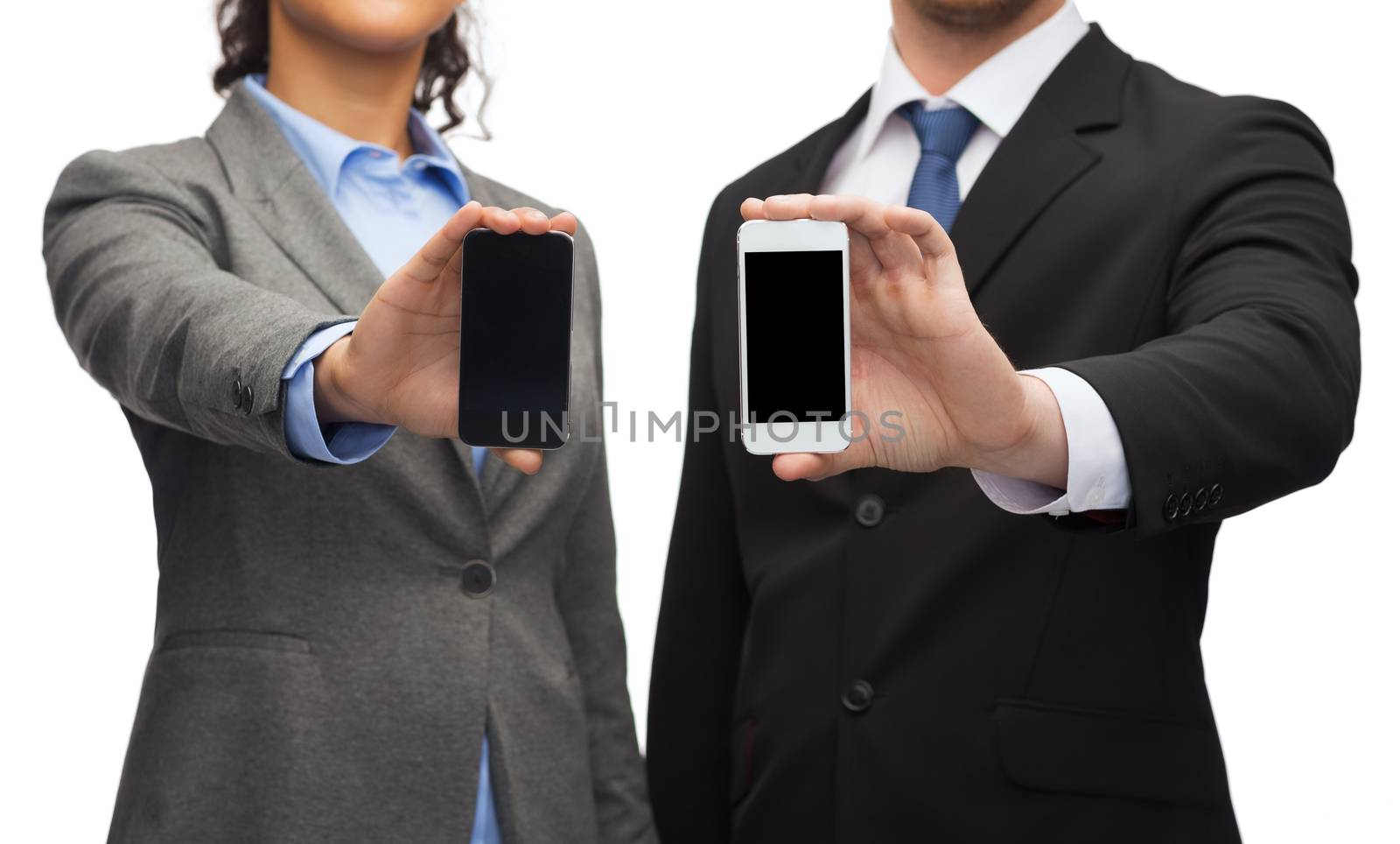 businessman and businesswoman with smartphones by dolgachov