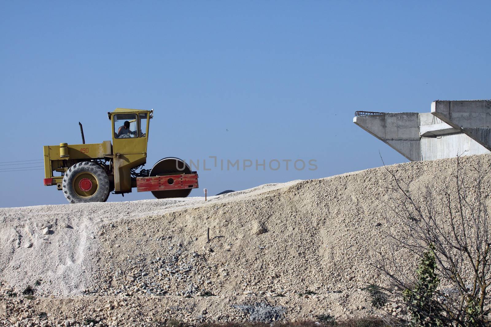 Road roller in work on the new highway