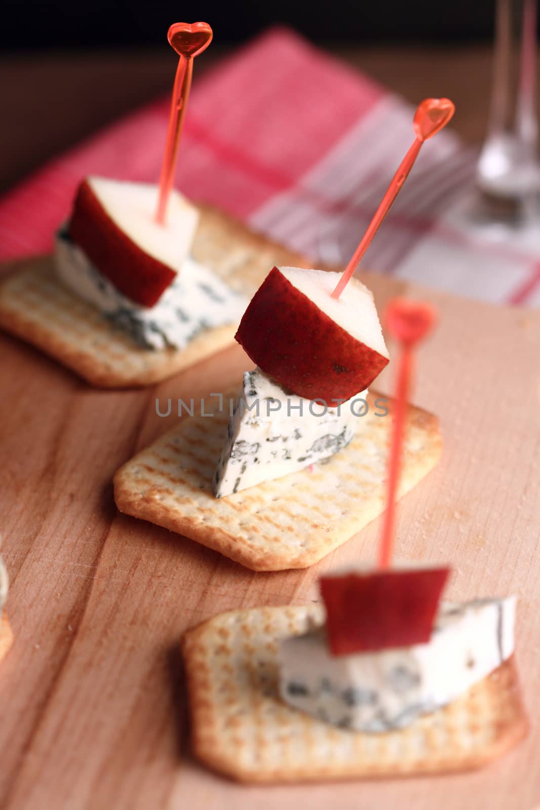 party bites with biscuit, camembert and a slice of pear 