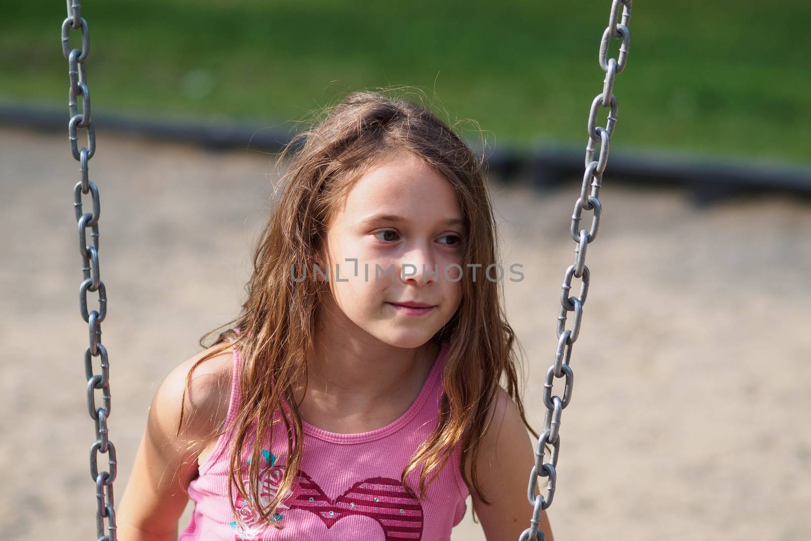 Girl sitting on a swing by Talanis