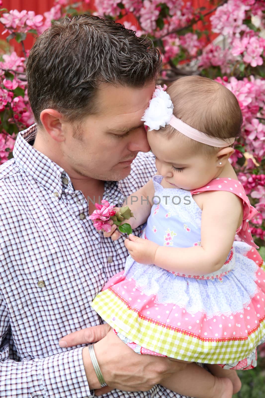 Father and daughter playing outside on the farm