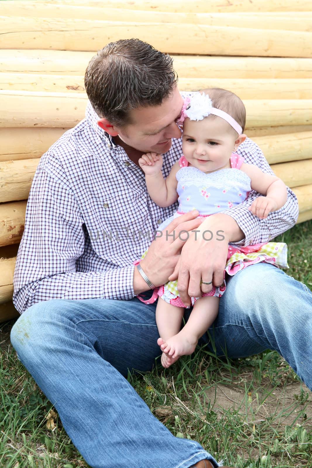 Father and daughter playing outside on the farm 