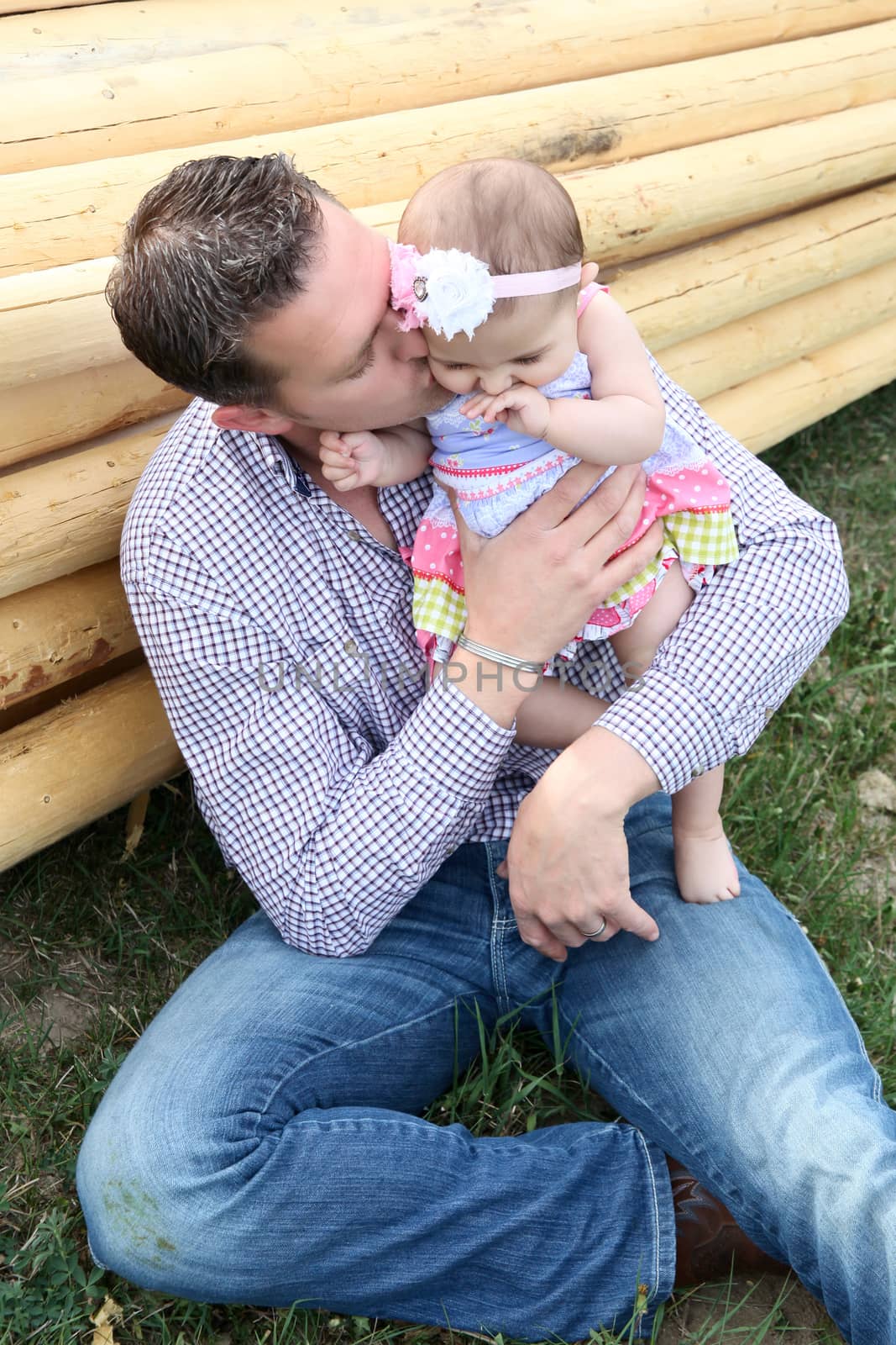 Father and daughter playing outside on the farm 