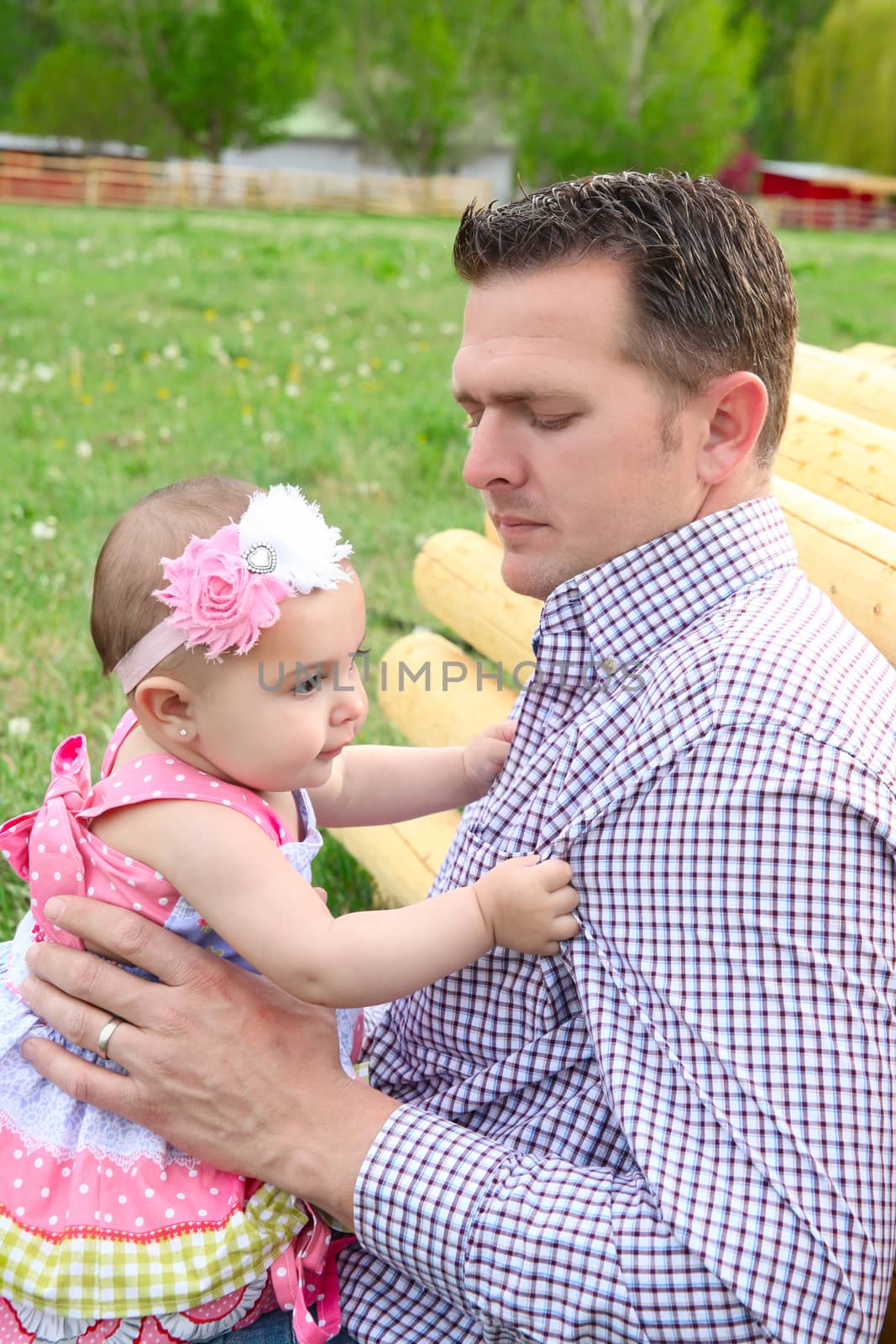 Father and daughter playing outside on the farm 