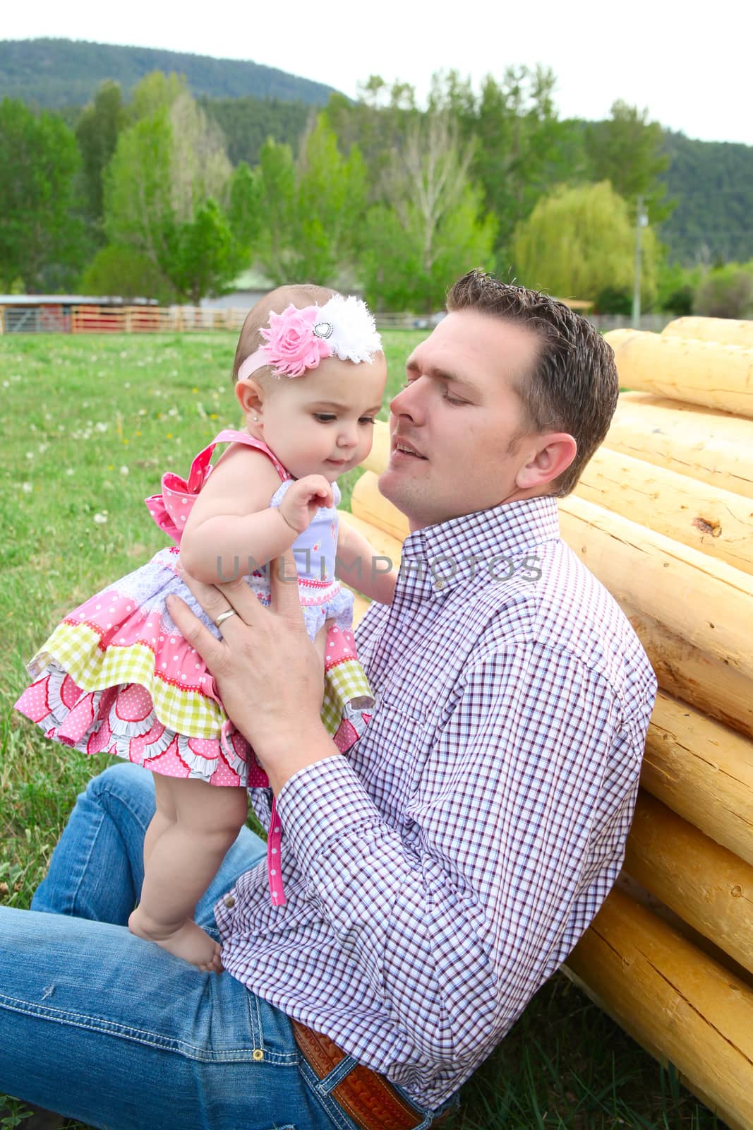 Father and daughter playing outside on the farm 