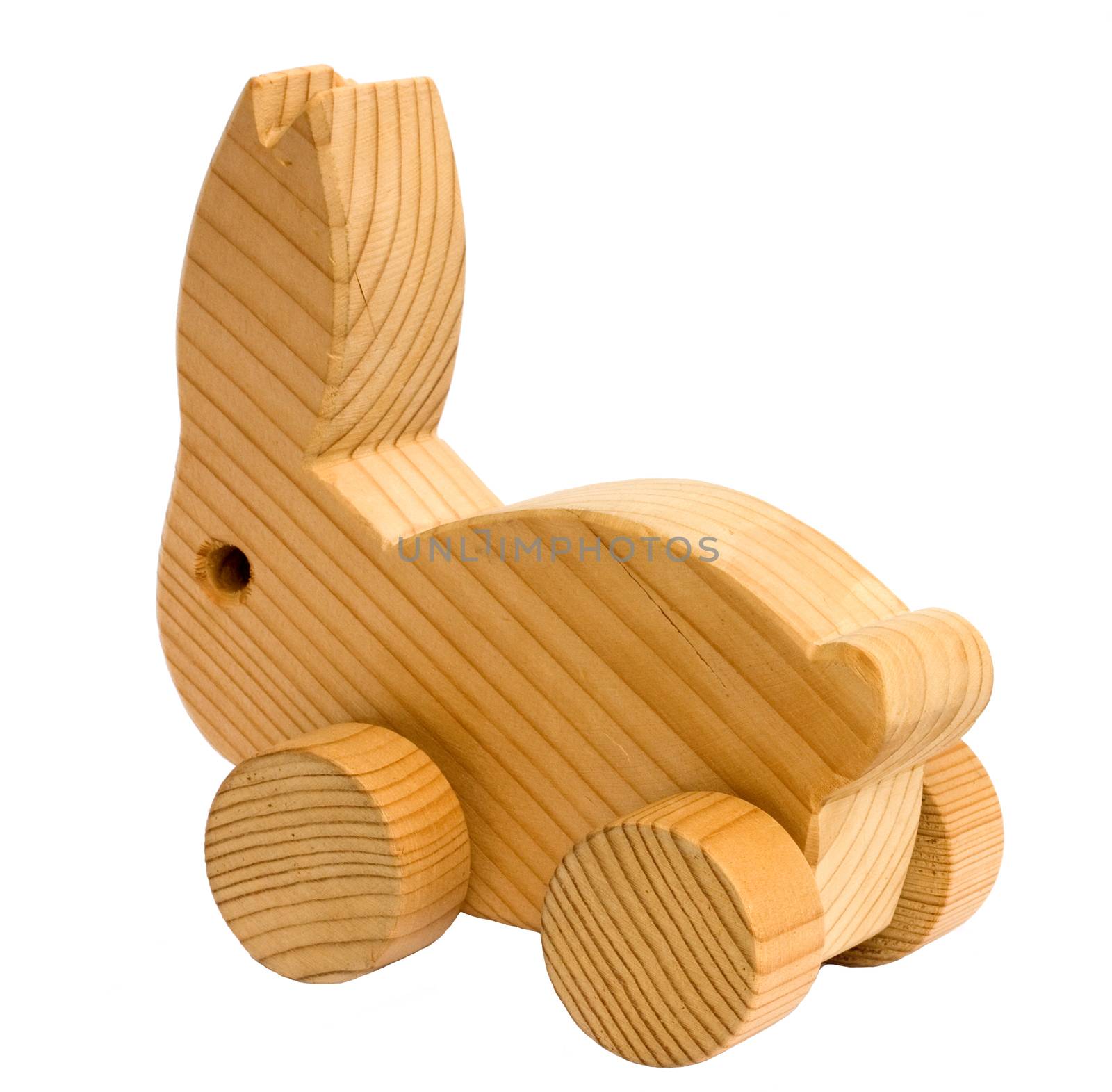 Old homemade wooden toy rabbit isolated on white