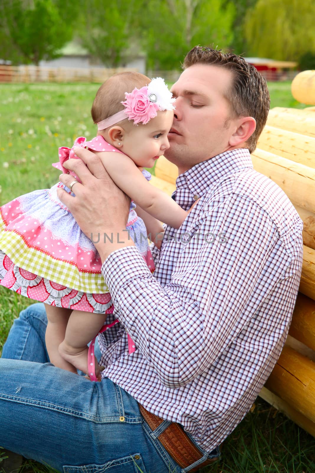 Father and daughter playing outside on the farm 