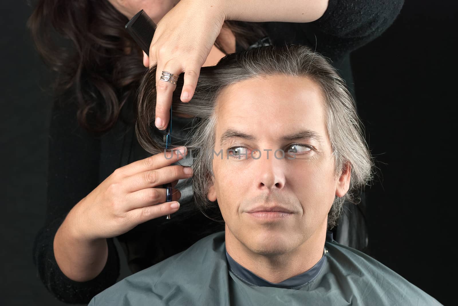 Close-up of a hair stylist removing bulk length.