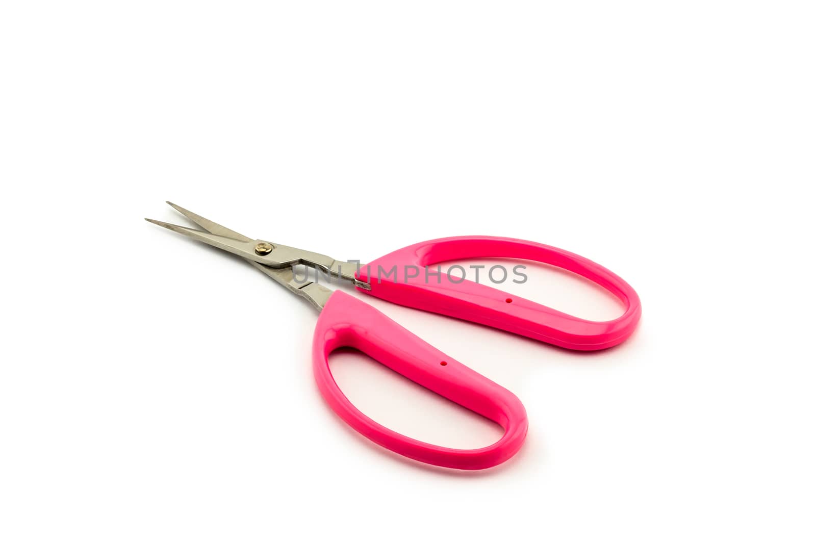 Pink scissors isolated on white background