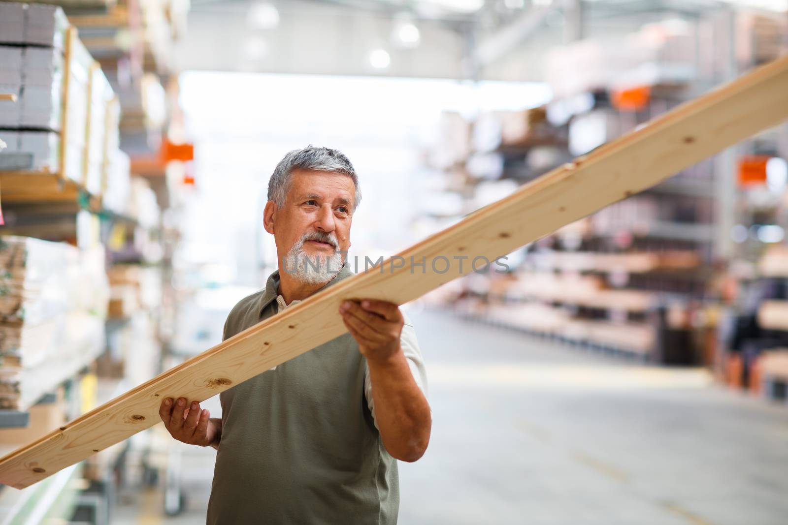 Man buying construction wood in a  DIY store for his DIY home re-modeling project