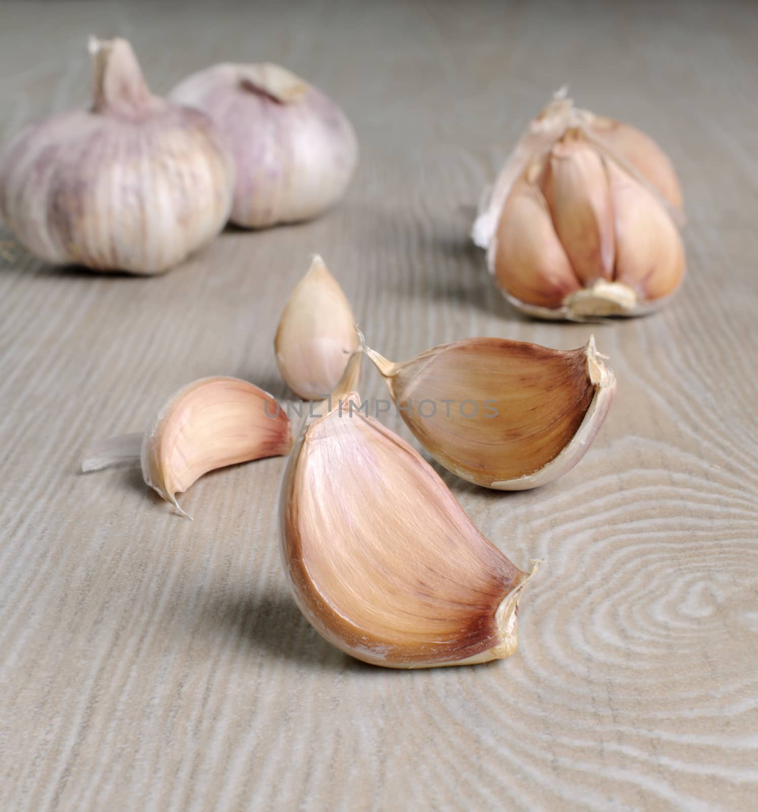 Garlic cloves are a handful on the table