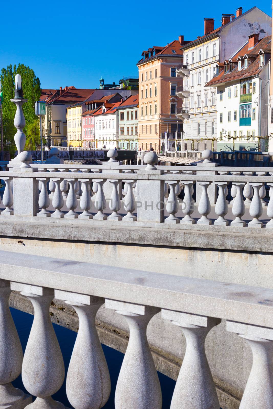 Romantic medieval Ljubljana's city center, the capital of Slovenia, Europe. Gallus bank of river Ljubljanica with Cobblers' Bridge or the Shoemakers' Bridge.