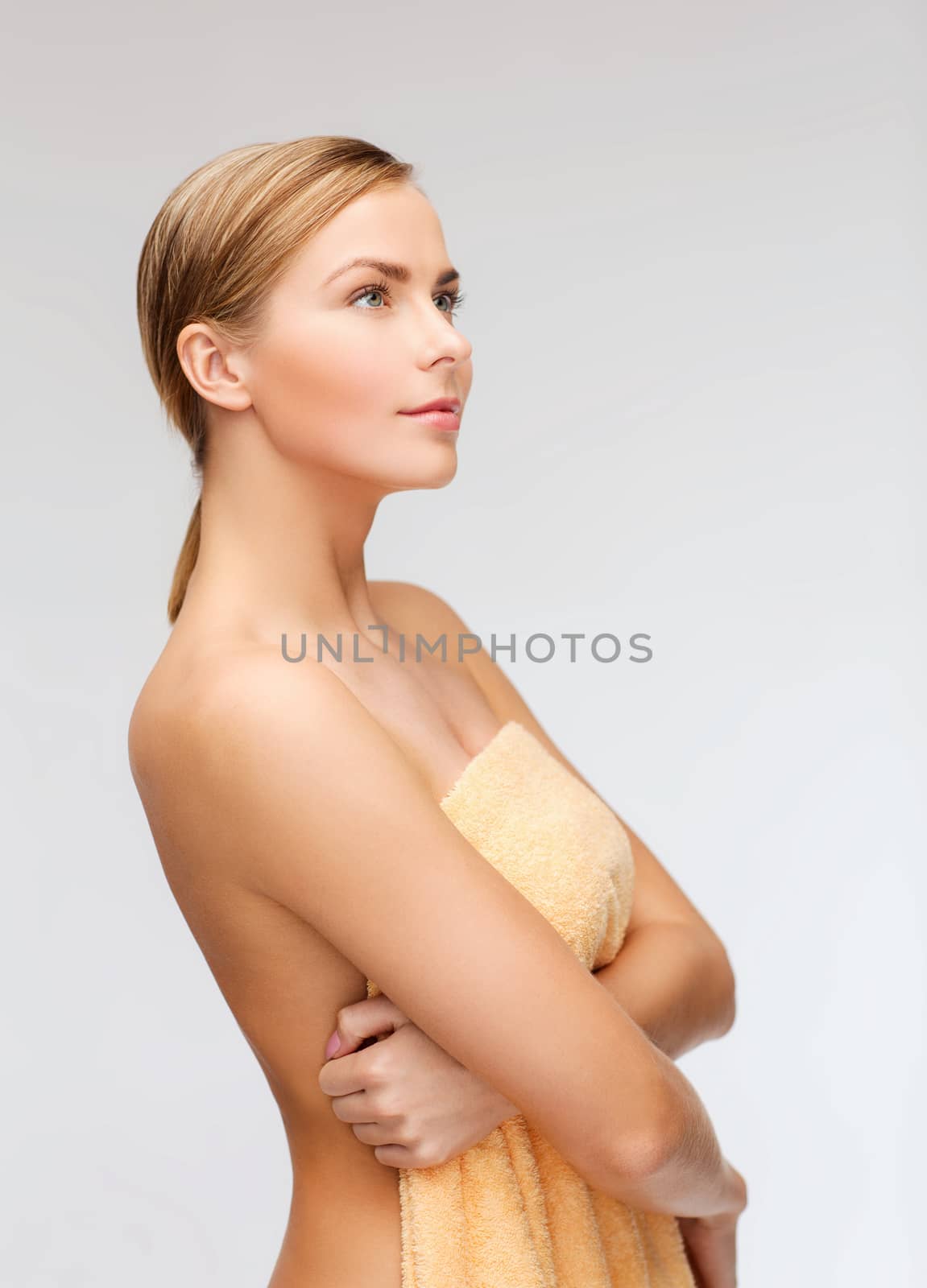 health and beauty concept - beautiful woman in towel
