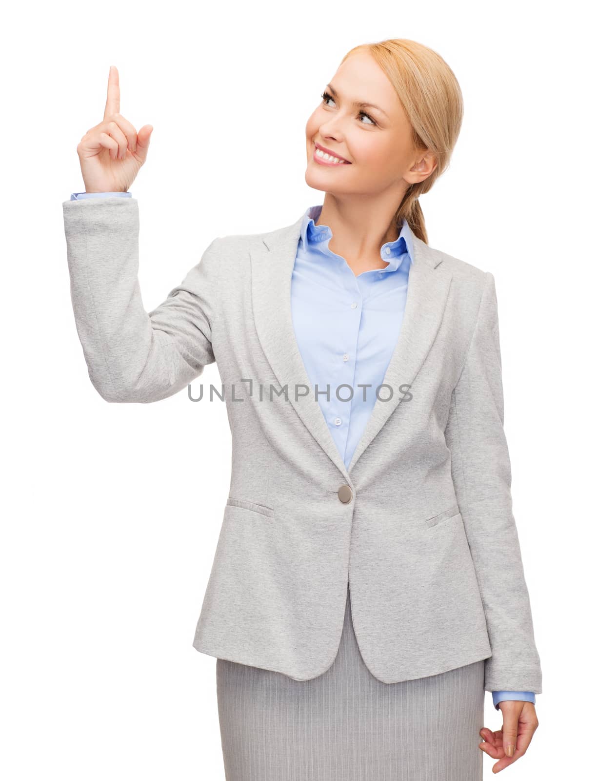 business and education concept - attractive young businesswoman with her finger up looking up
