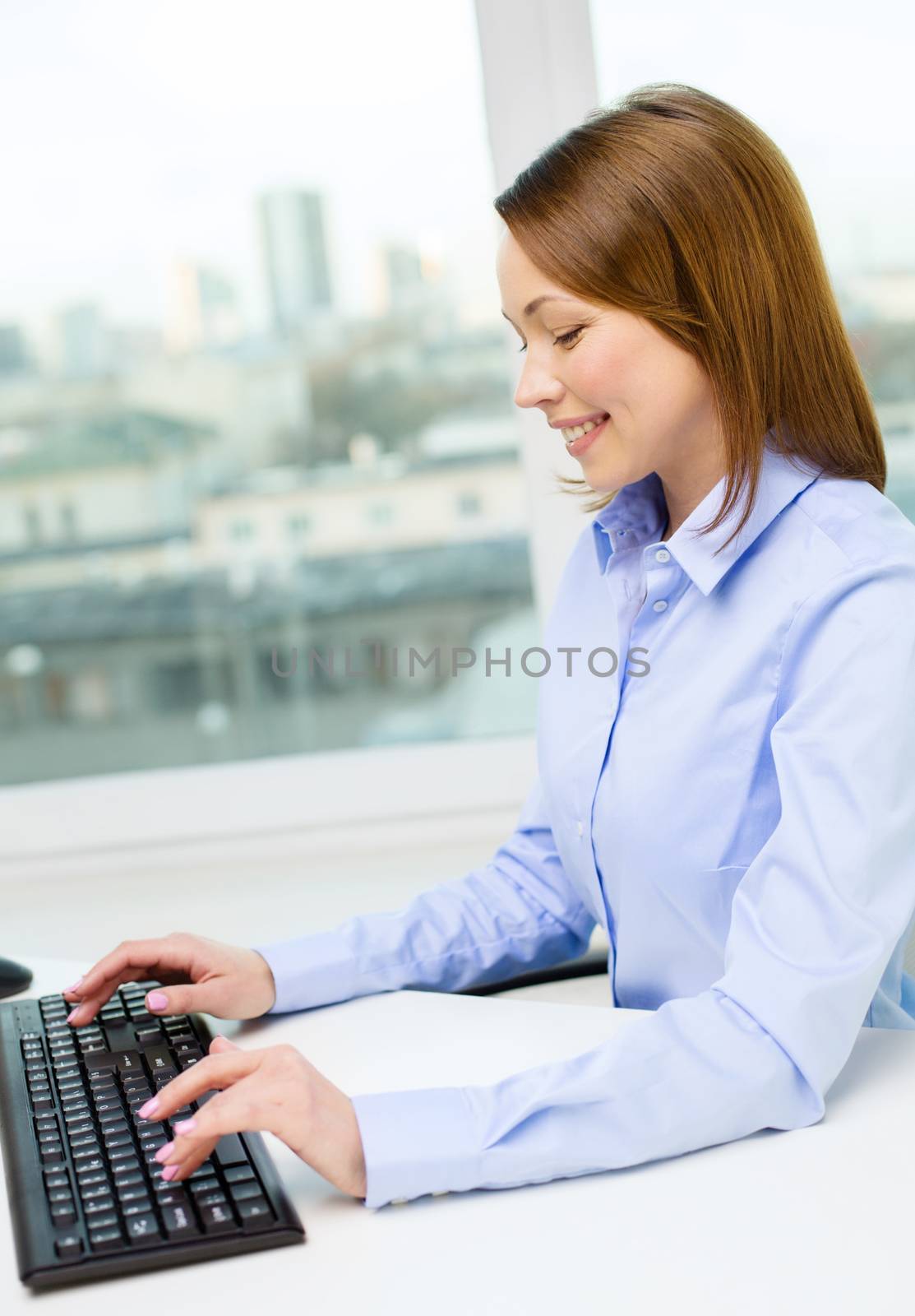 smiling businesswoman or student with computer by dolgachov