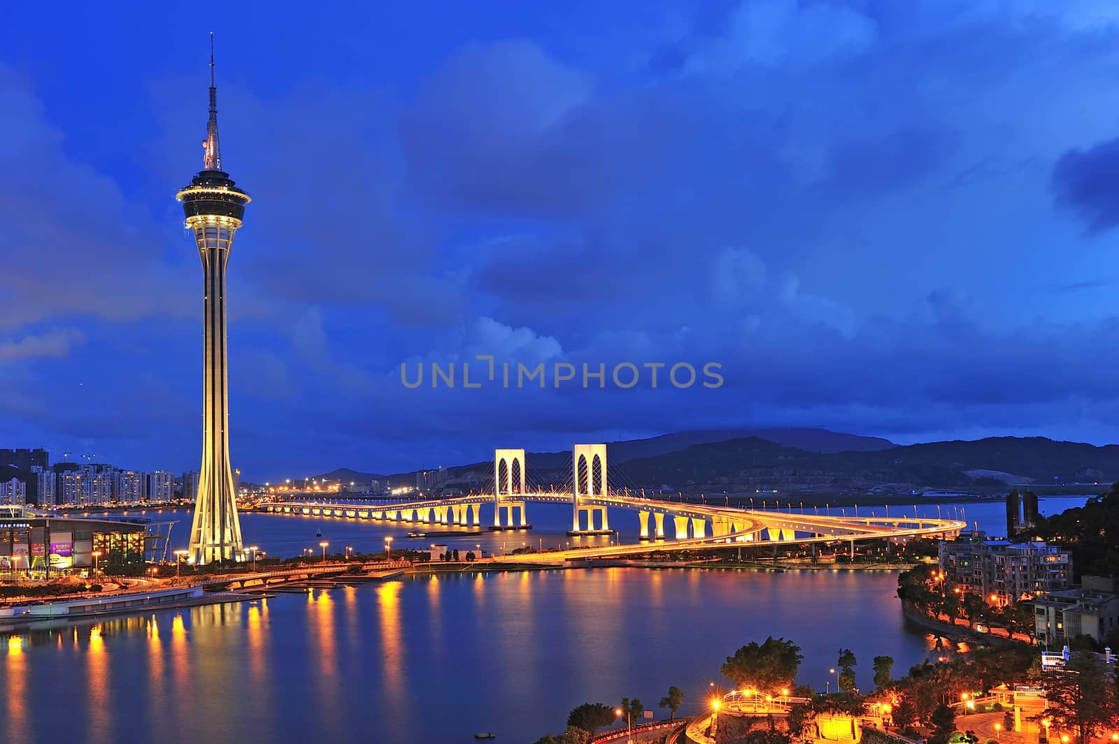 Urban landscape of Macau with famous traveling tower under blue by think4photop