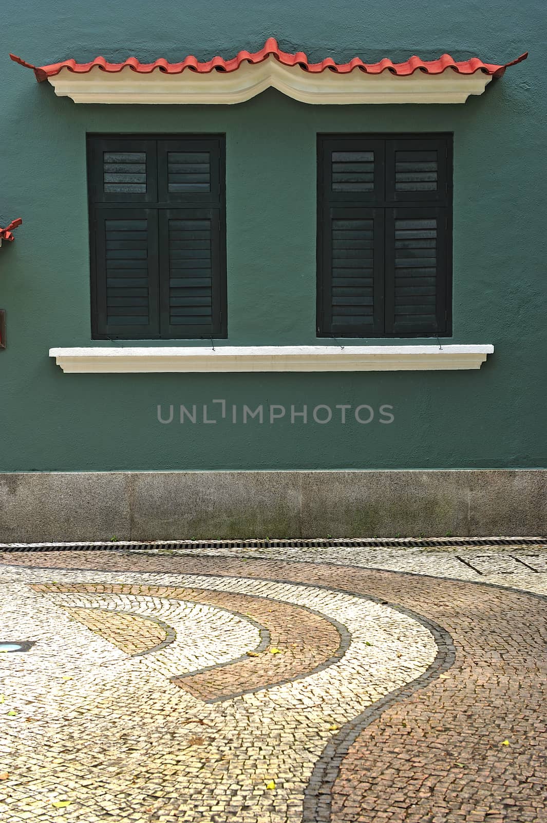 green twin windows in green background in Macau.