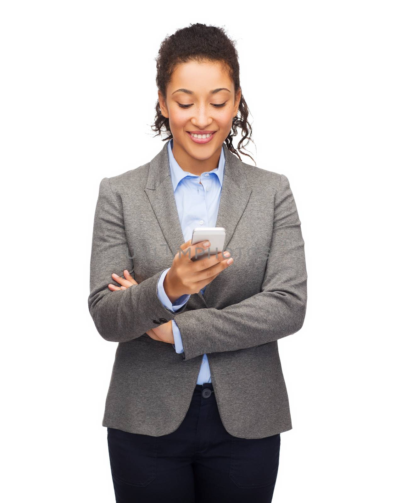 business, internet and technology concept - smiling african-american woman looking at smartphone